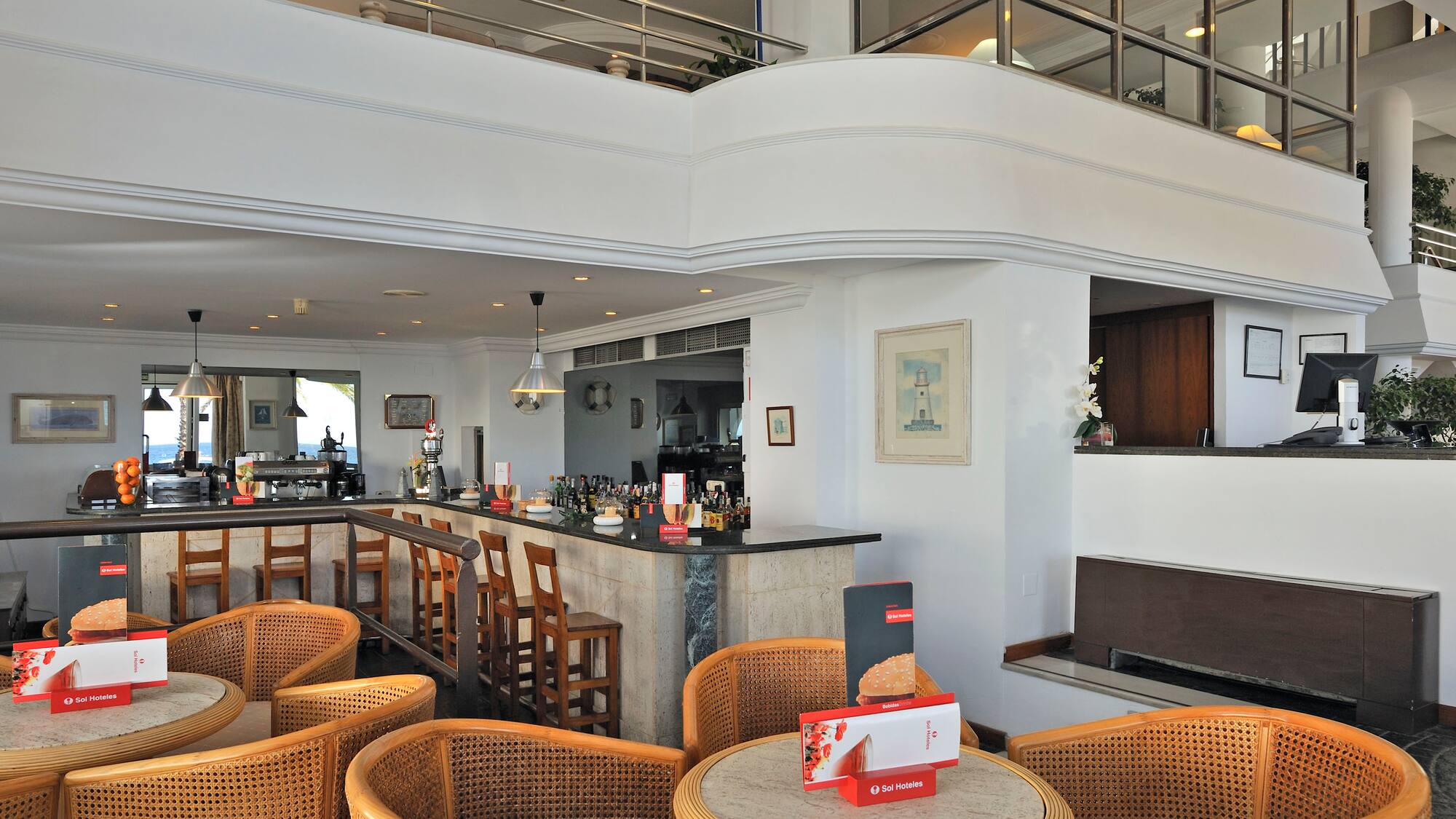 a room with a bar and chairs