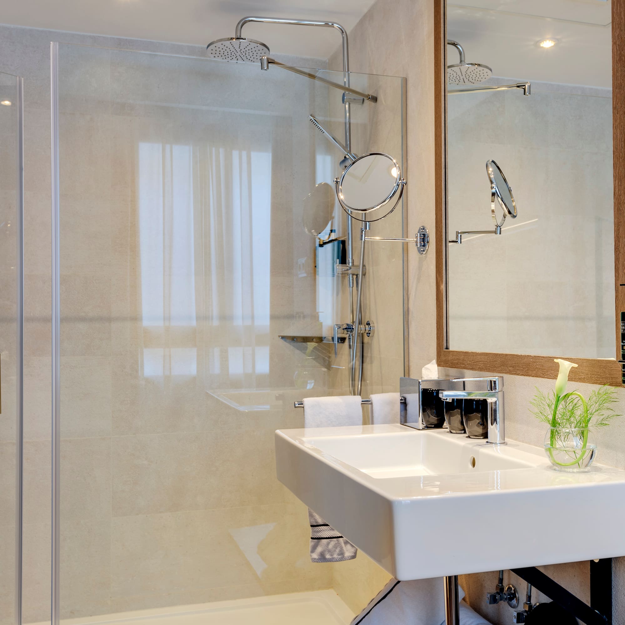 a bathroom with a shower and sink