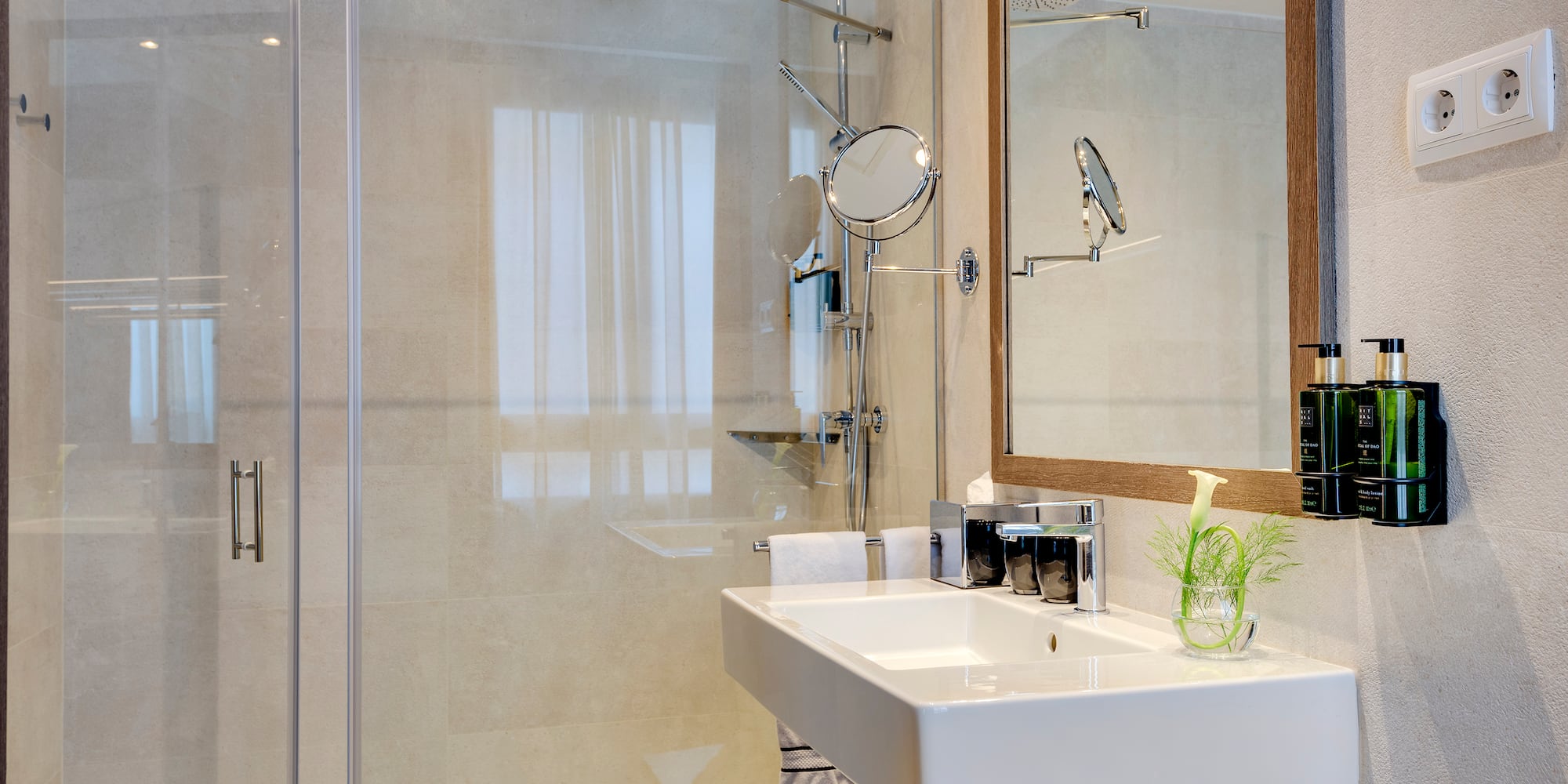 a bathroom with a shower and sink