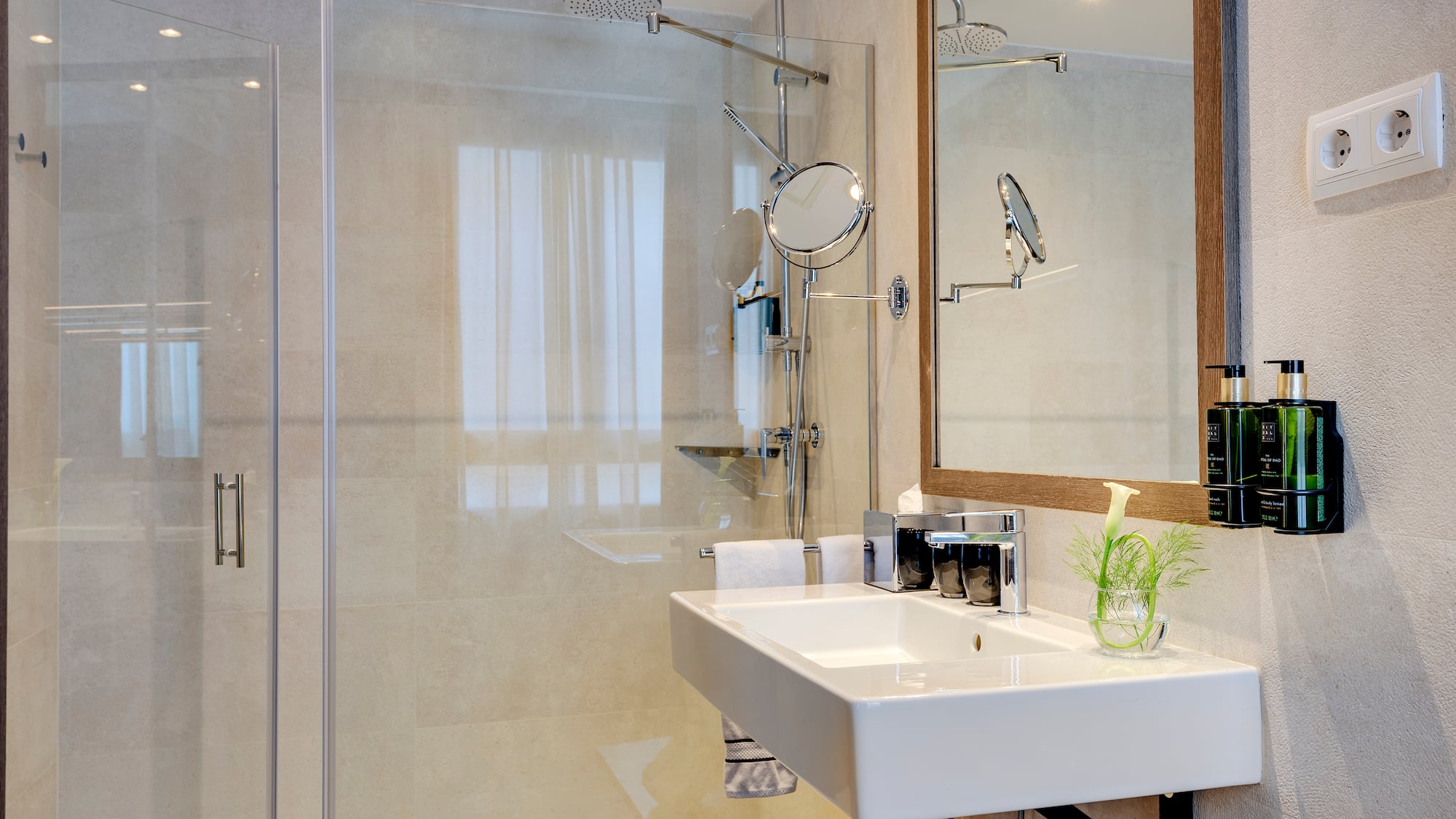 a bathroom with a shower and sink