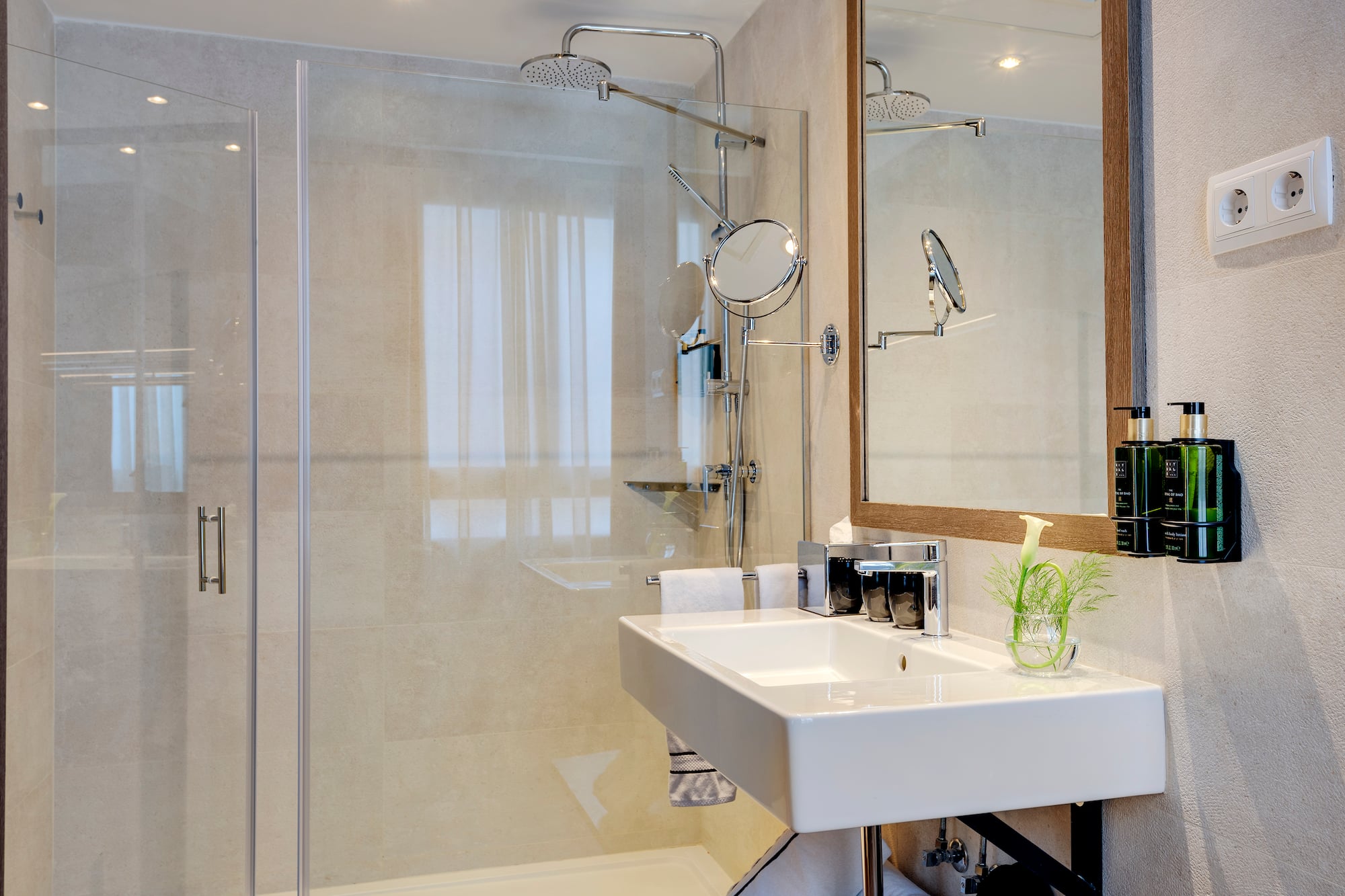 a bathroom with a shower and sink