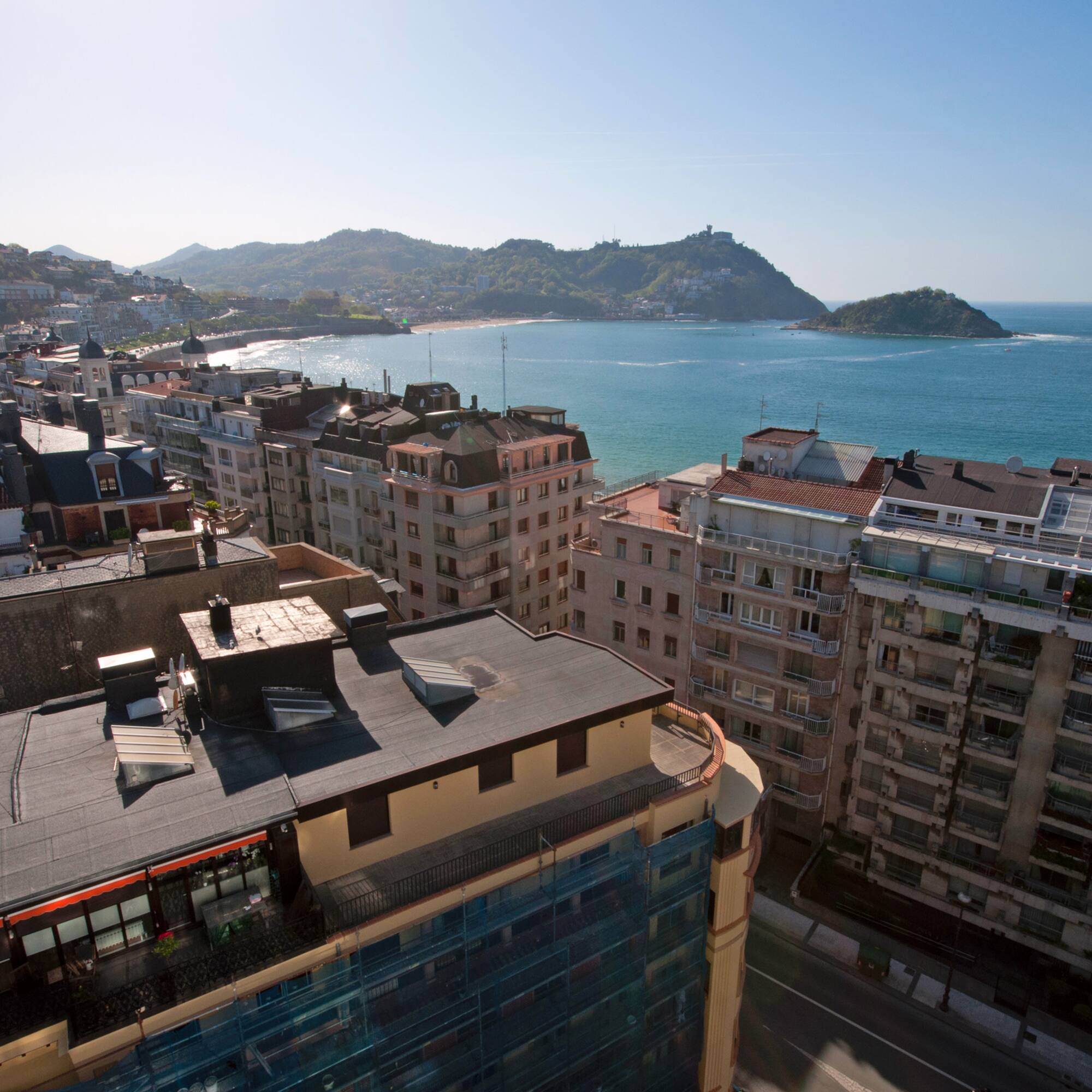 a city with buildings and water in the background