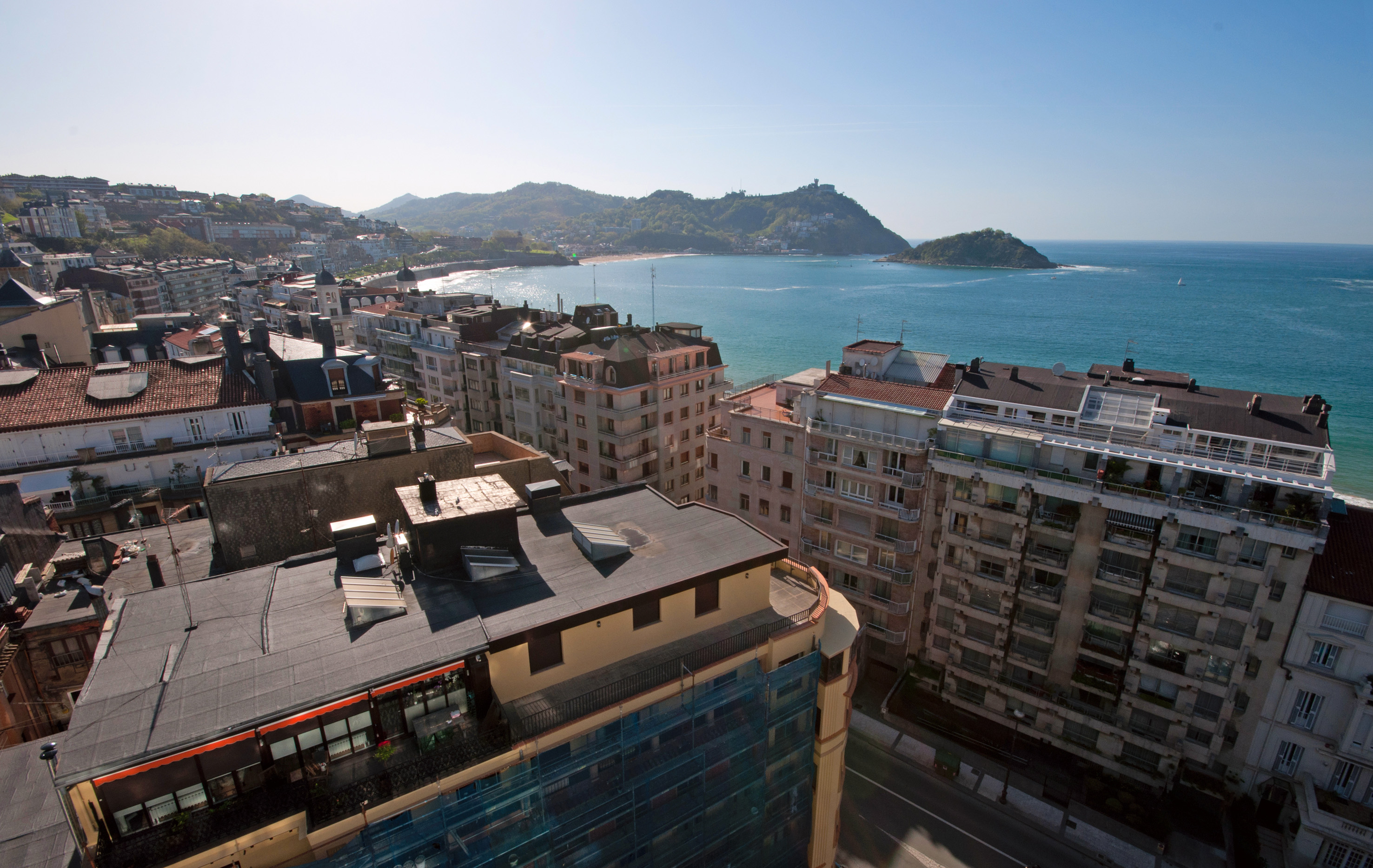 a city with buildings and water in the background