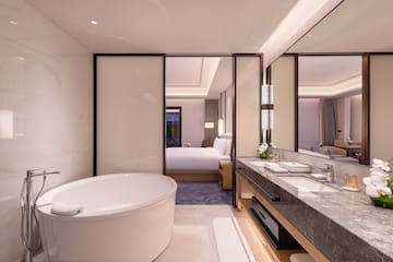 a bathroom with a tub and sink