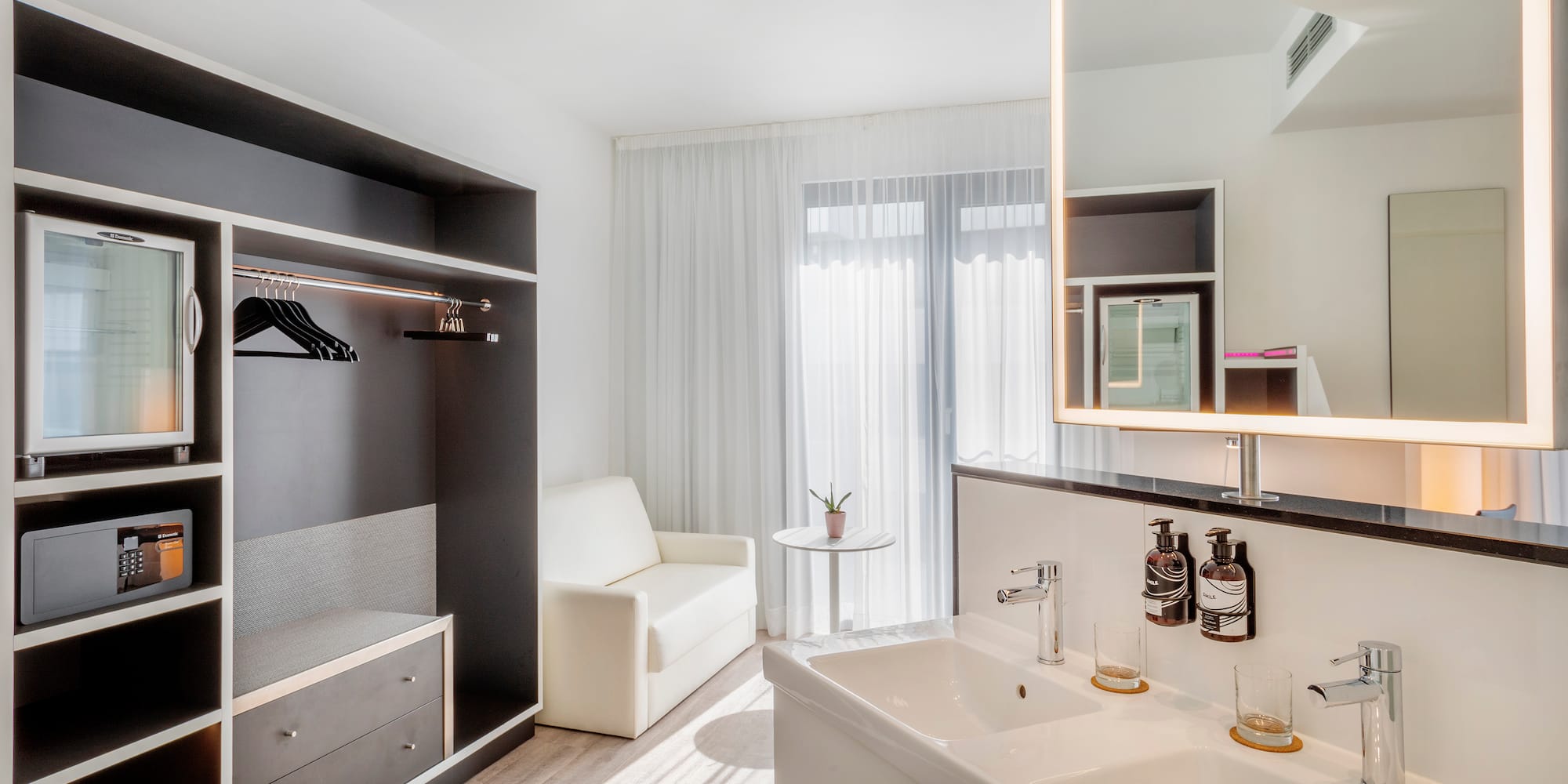 a bathroom with a mirror and sink