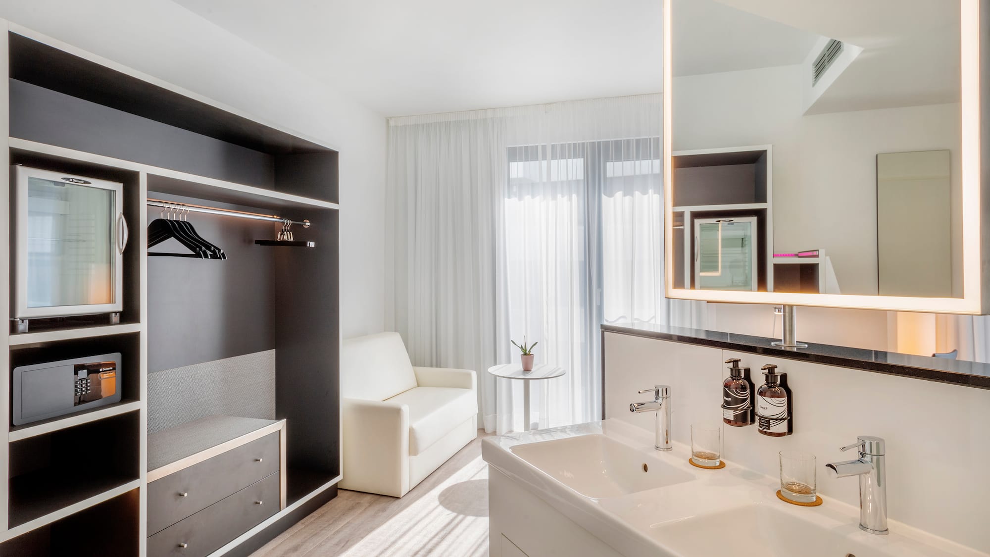 a bathroom with a mirror and sink