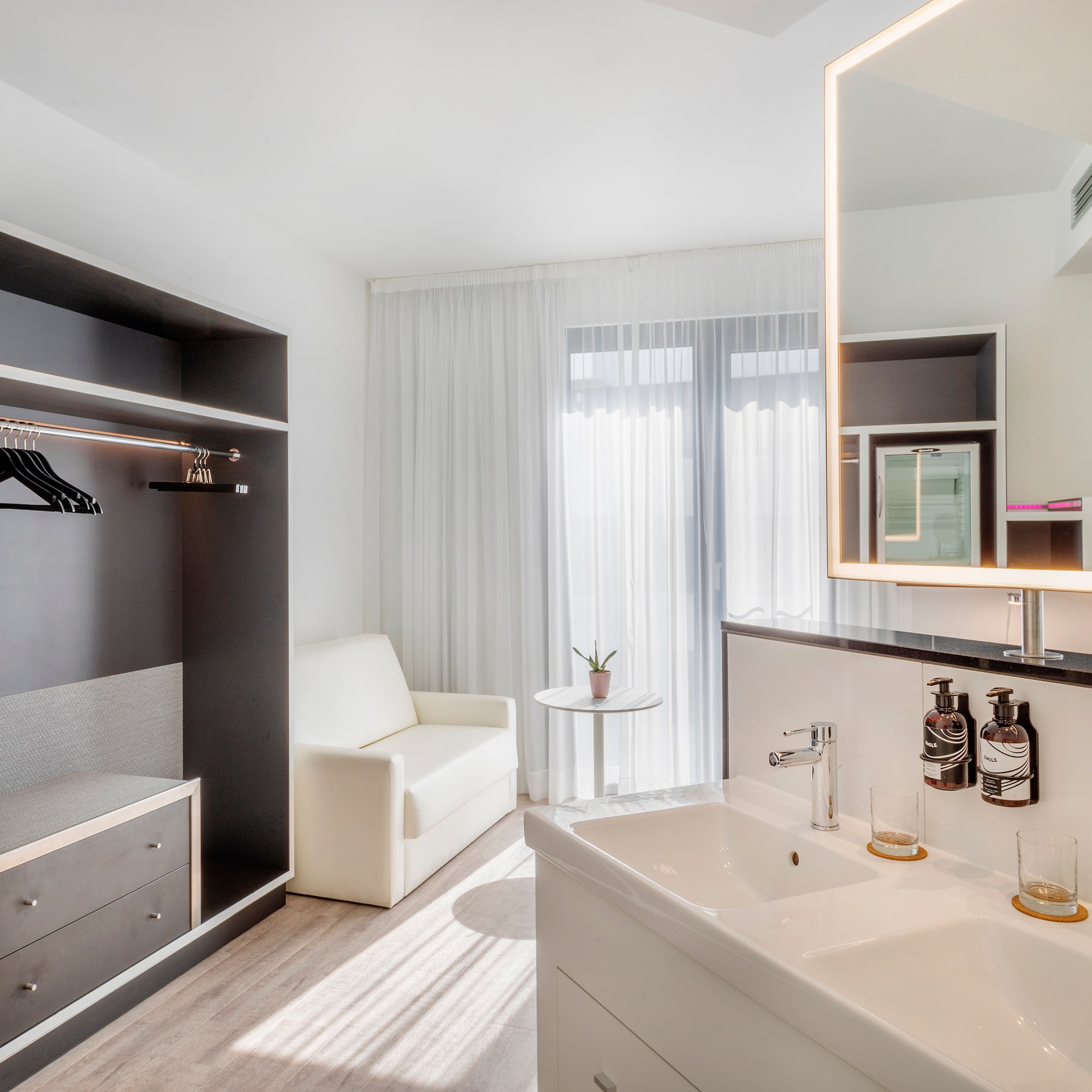 a bathroom with a mirror and sink