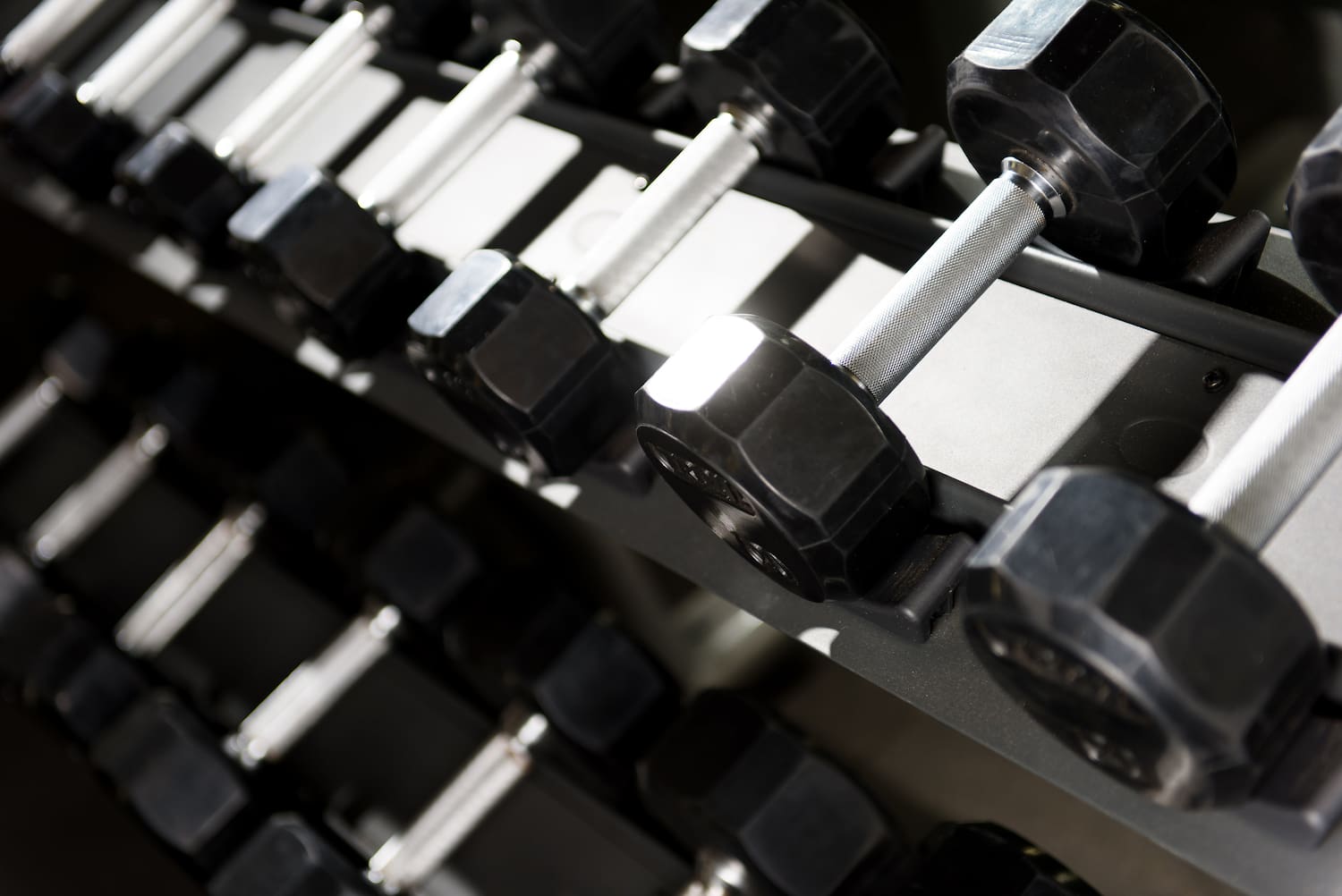 a close-up of a rack of dumbbells