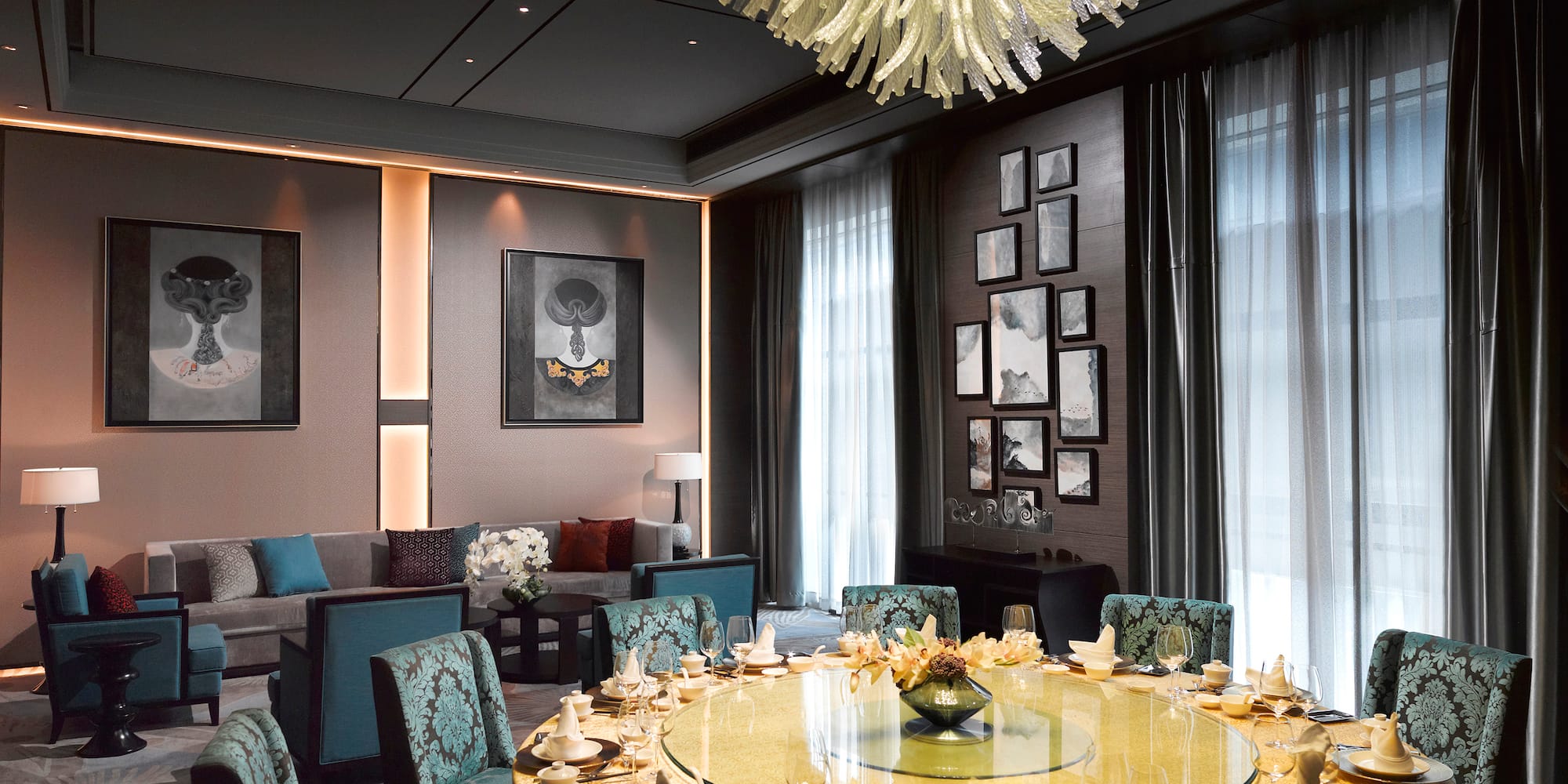 a room with a round table and chairs