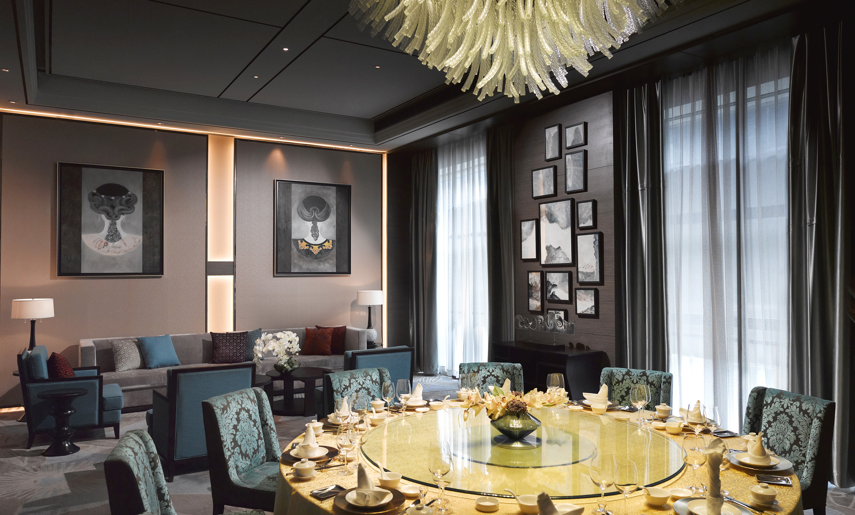 Luxurious private dining room with a large round table and modern elegant decor.