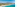 a beach with trees and a pier in the water