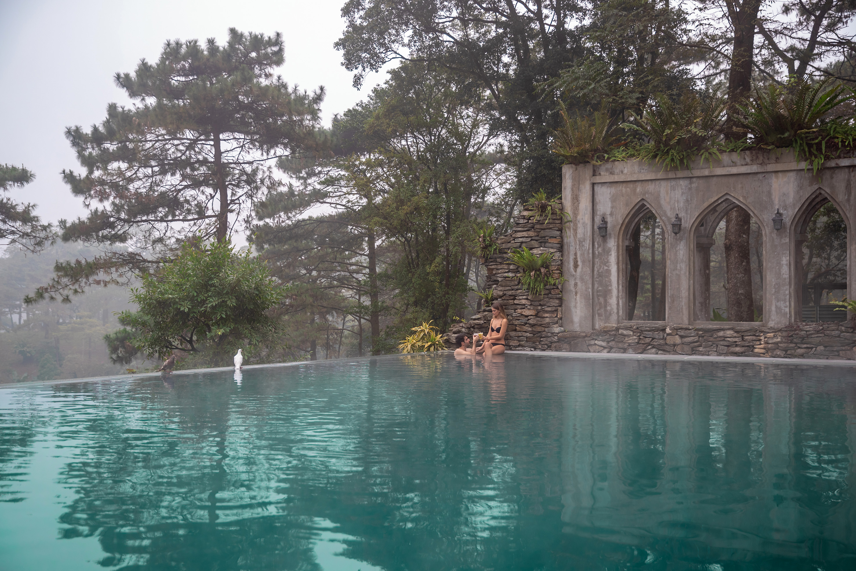 people sitting in a pool