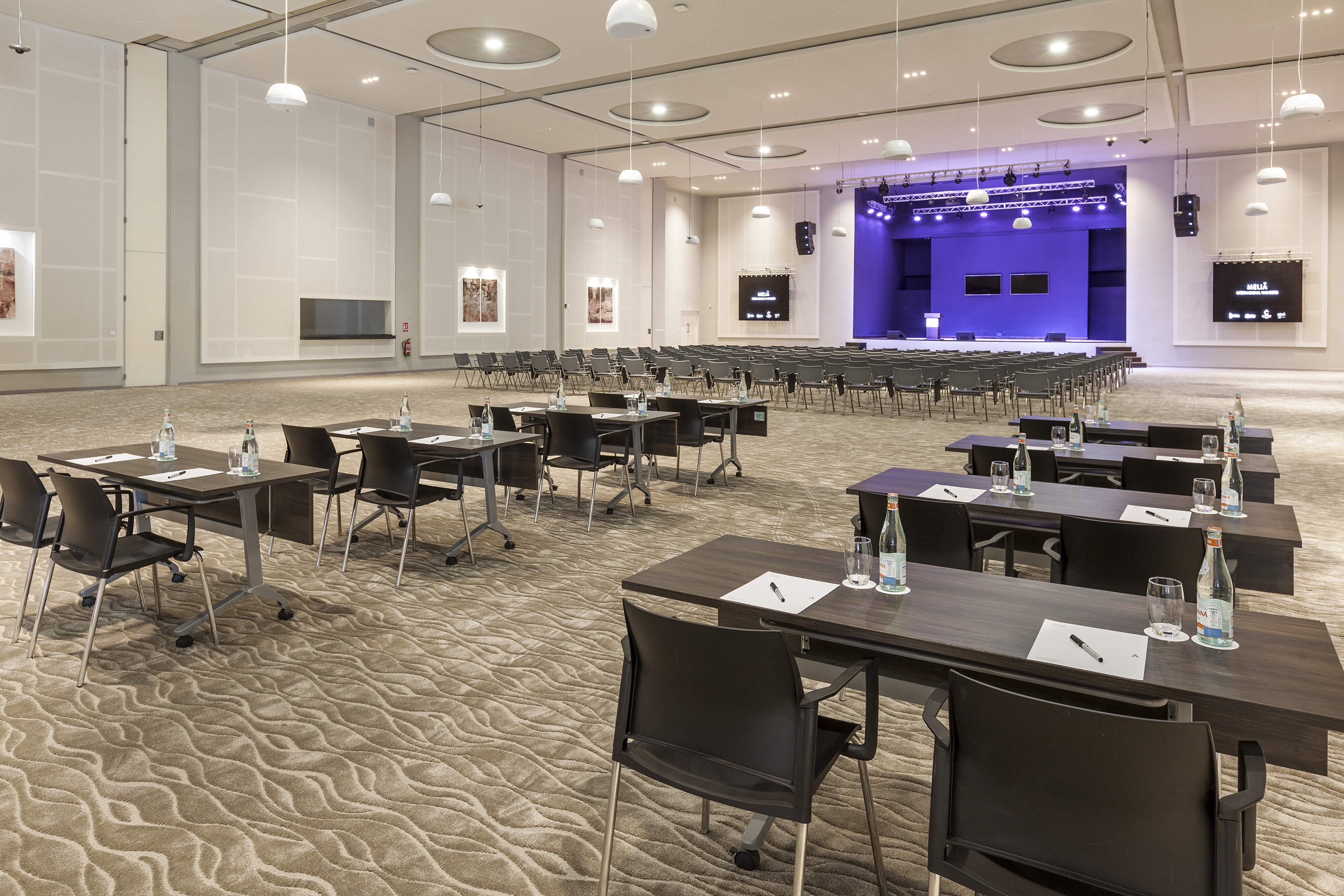 a room with tables and chairs