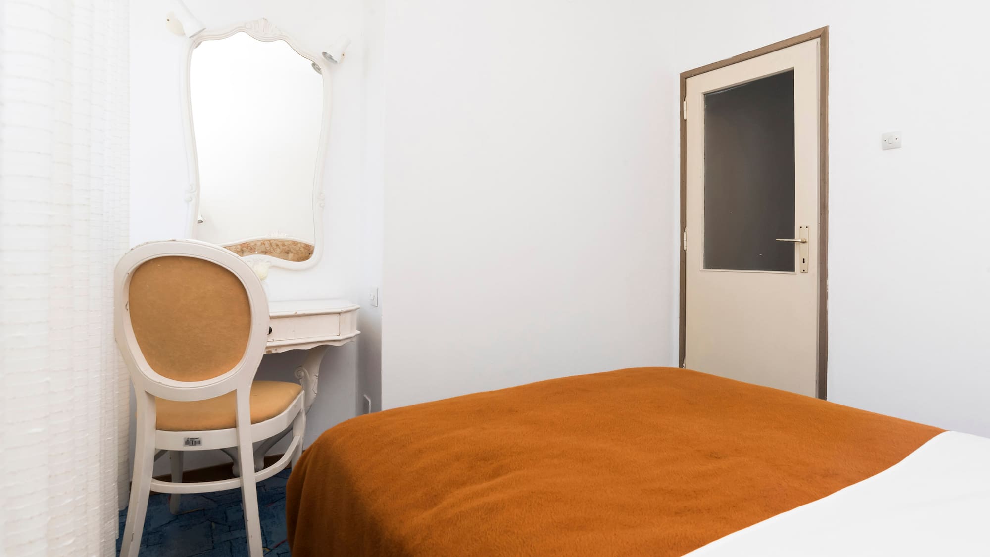 a room with a bed and a chair