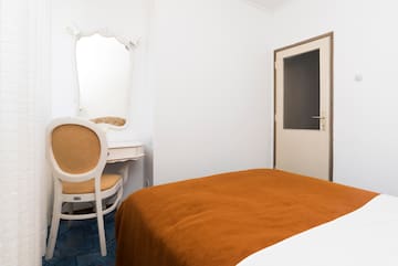 a room with a bed and a chair