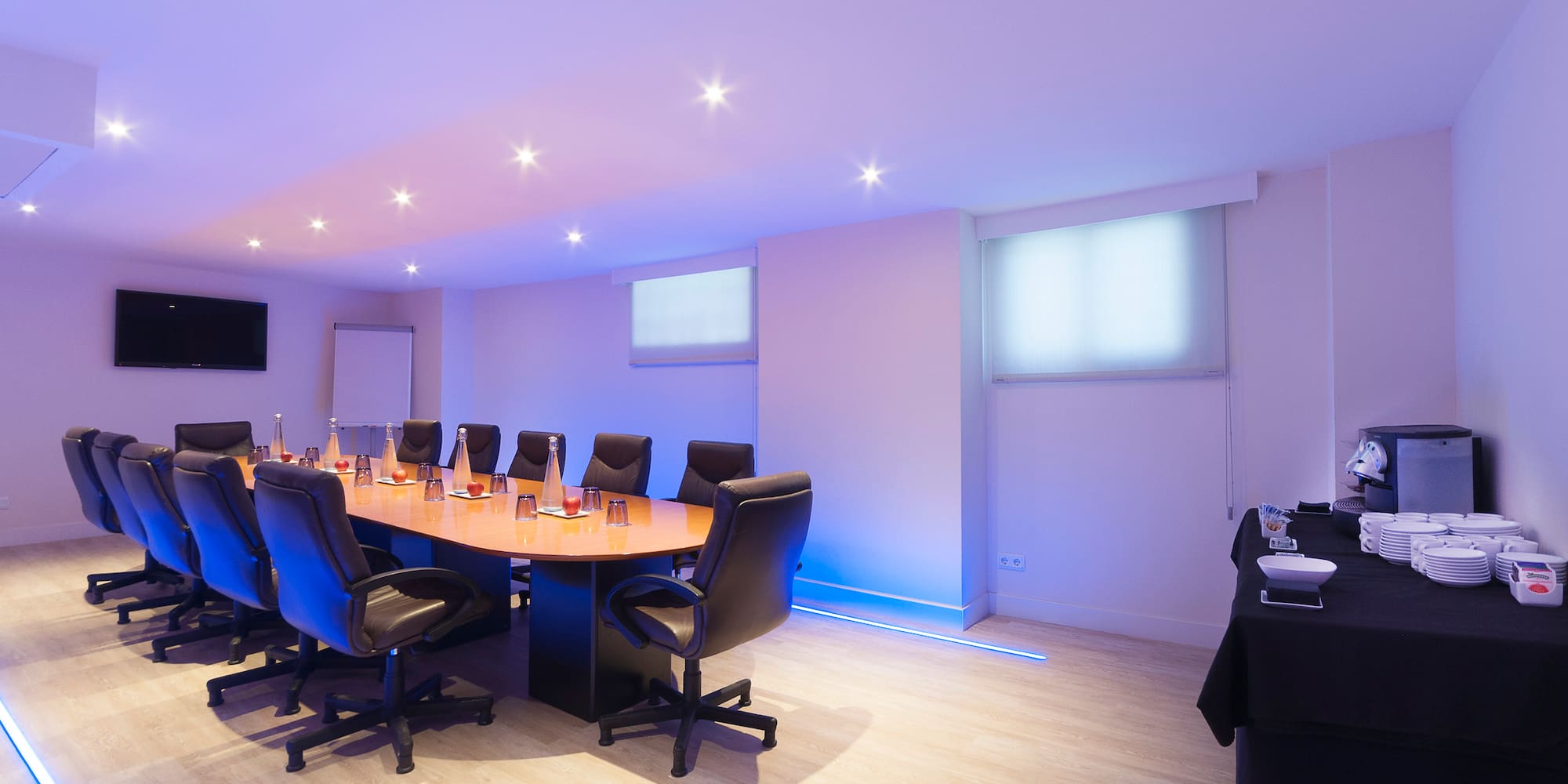 a conference room with a table and chairs