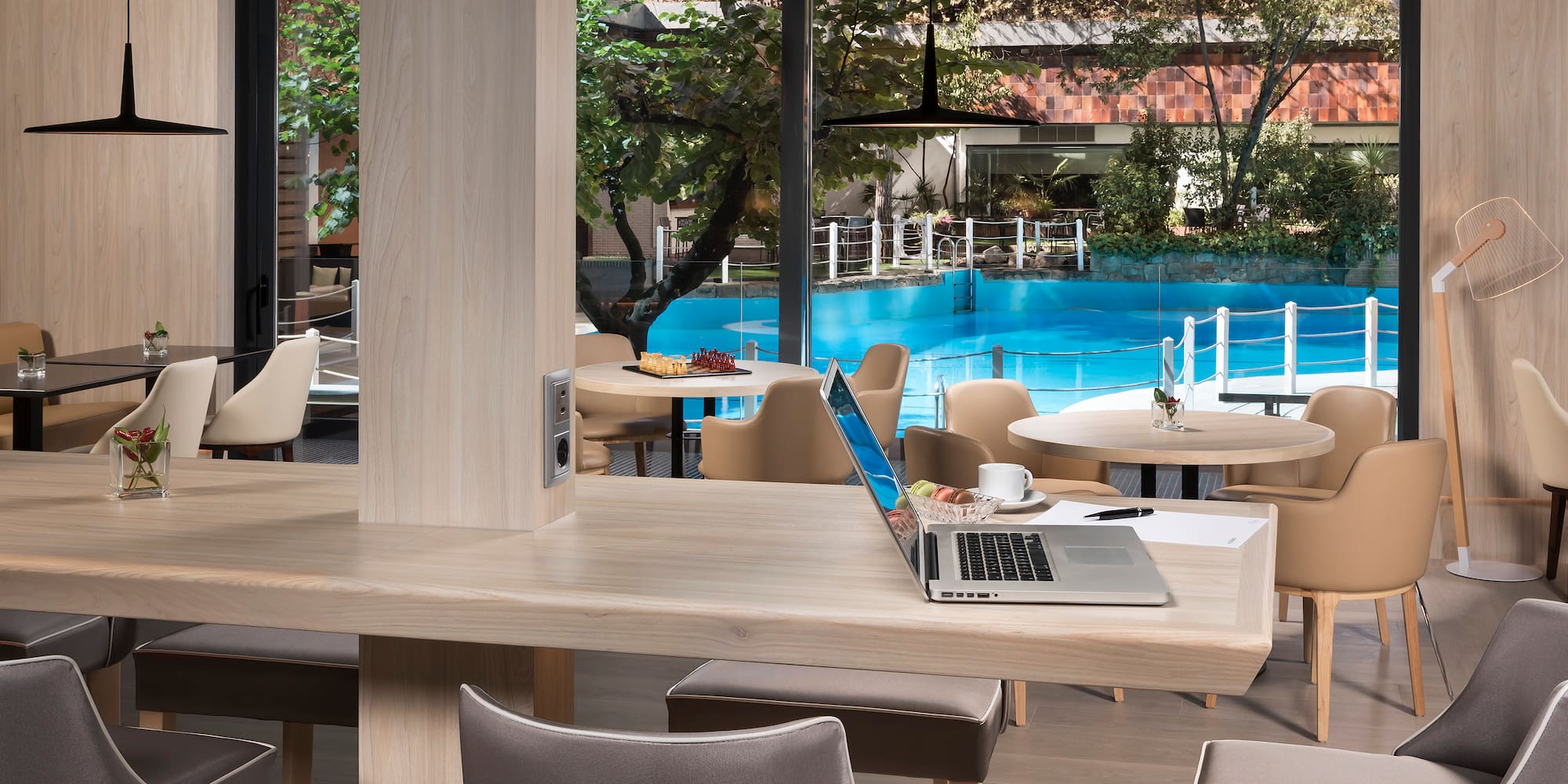 a laptop on a table in a restaurant