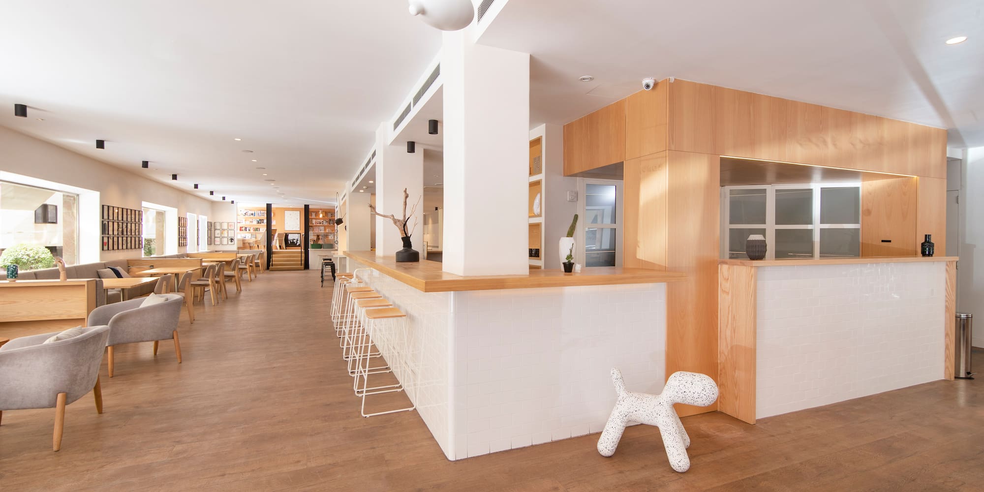 a room with a white wall and a wooden floor