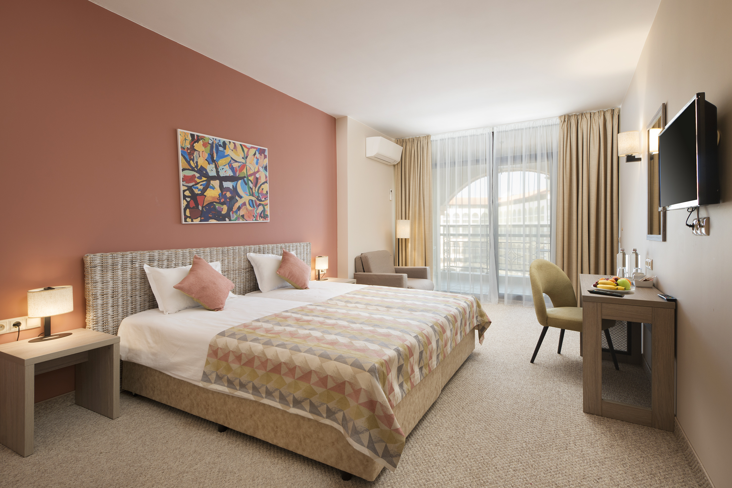 a bedroom with a bed and a desk