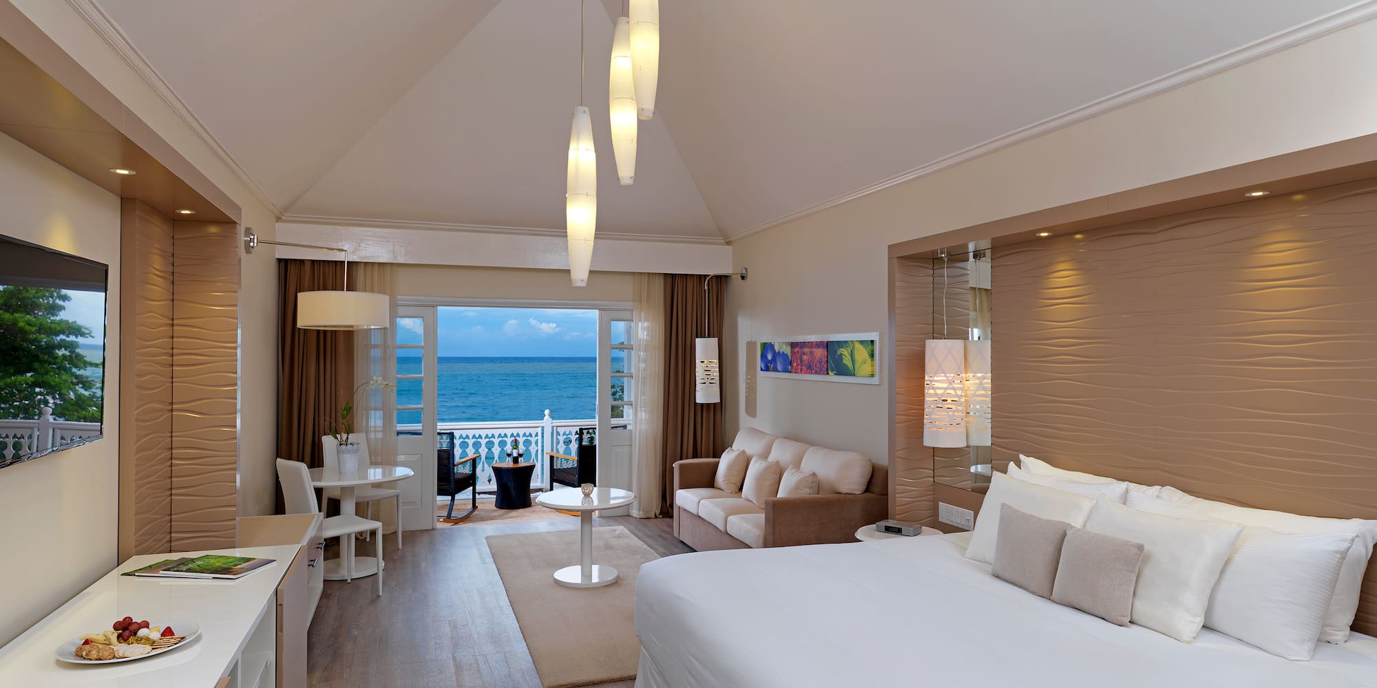 a room with a bed and a table and chairs