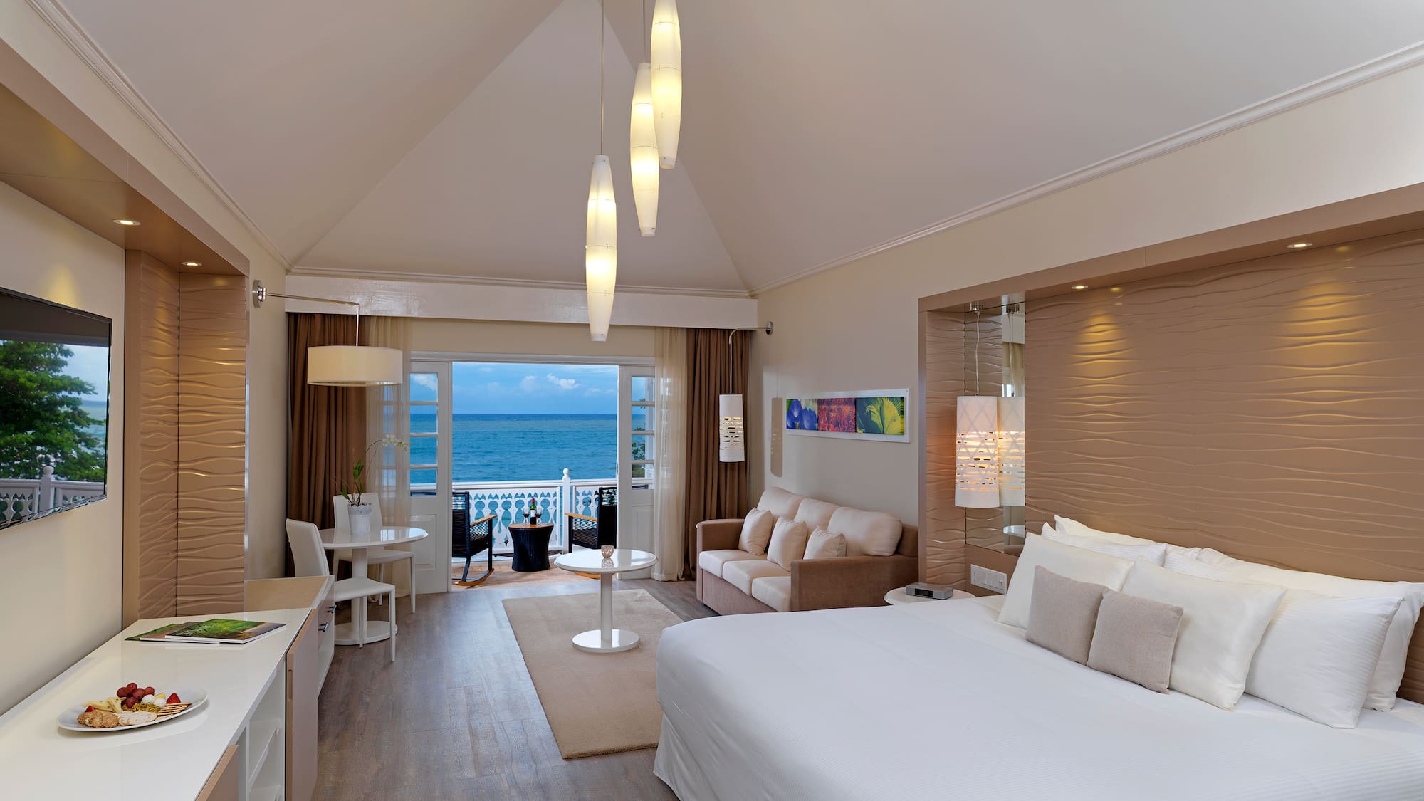 a room with a bed and a table and chairs