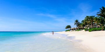 a person walking on a beach