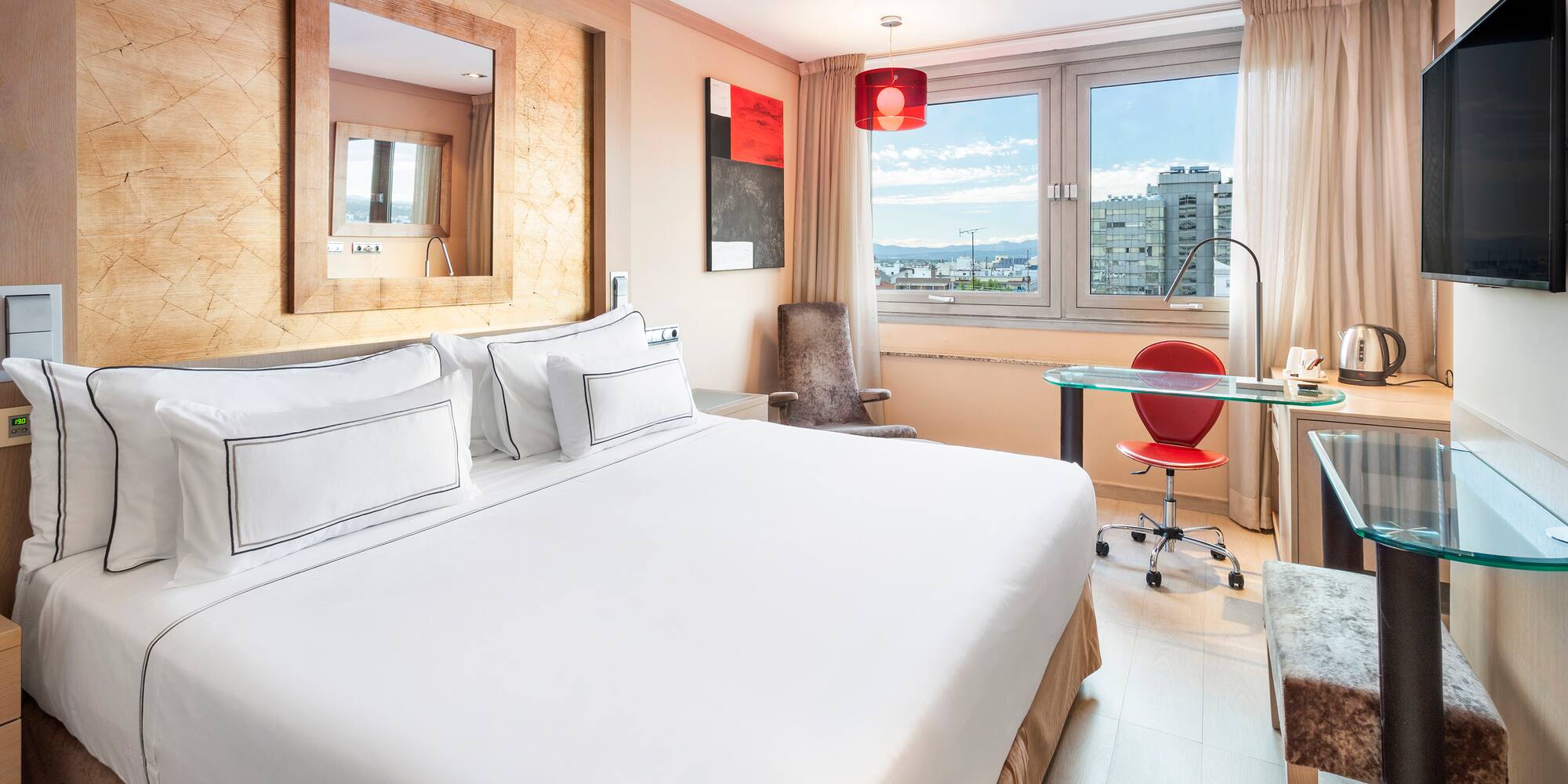 a room with a bed and a desk