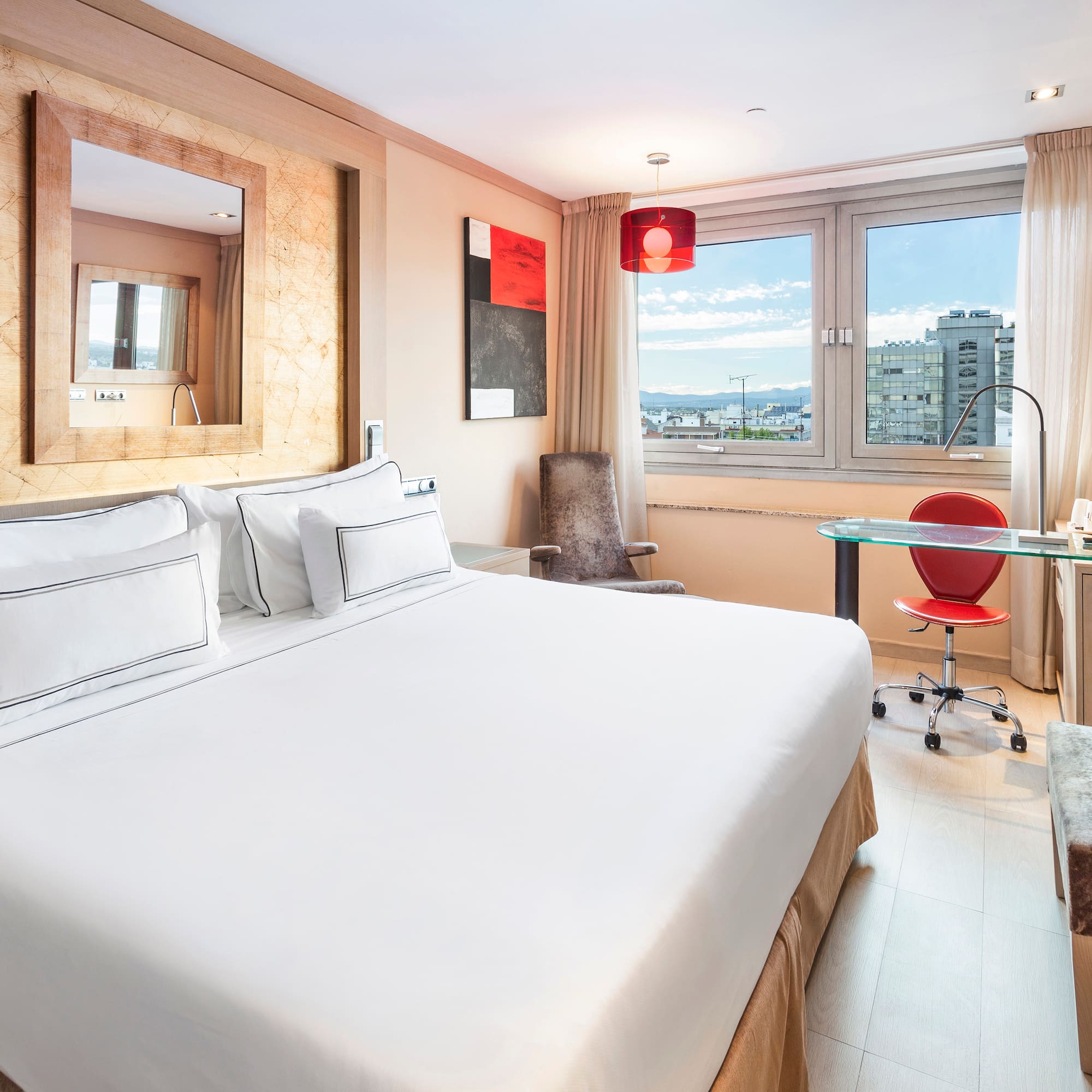 a room with a bed and a desk