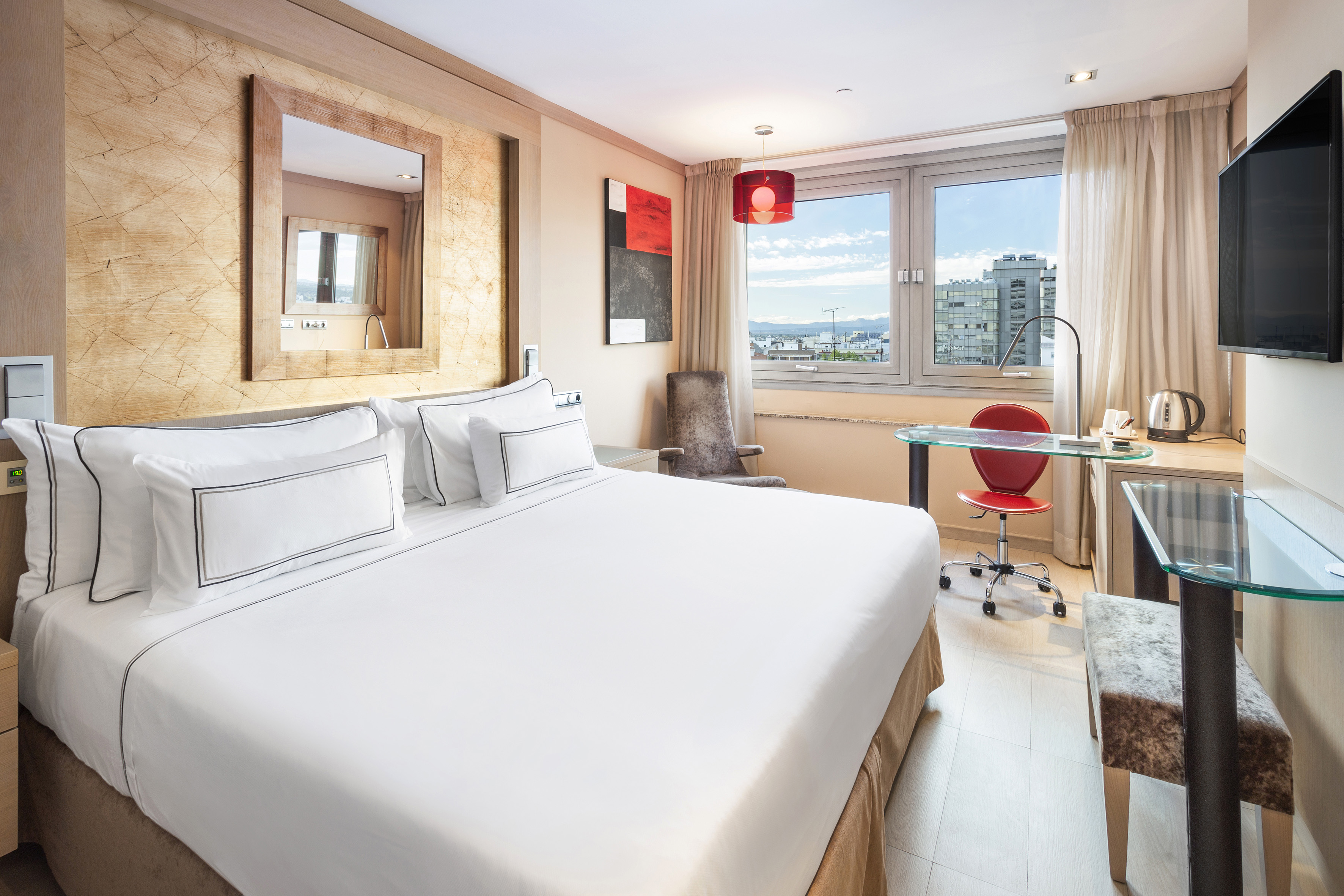 a room with a bed and a desk