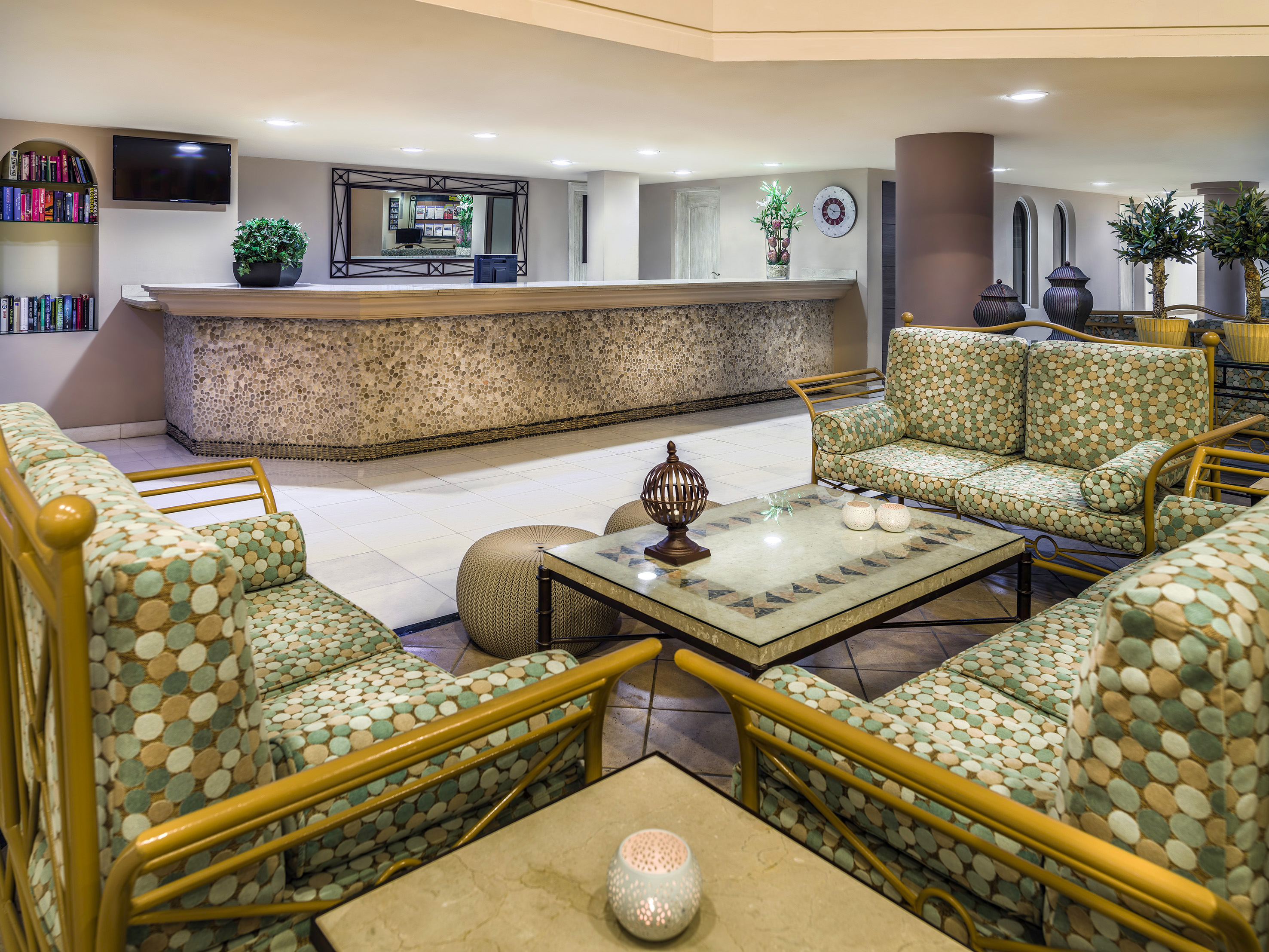 a lobby with a reception desk and chairs