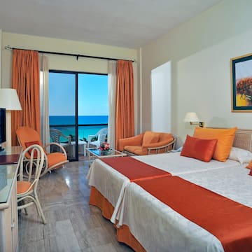 a room with a television and a bed