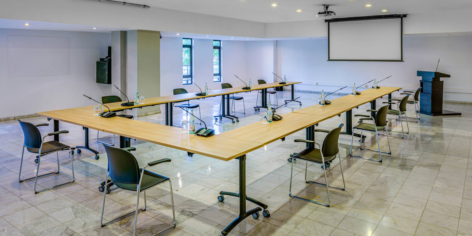 a room with a large table and chairs