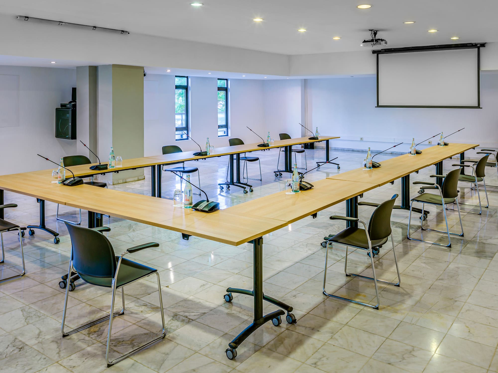 a room with a large table and chairs
