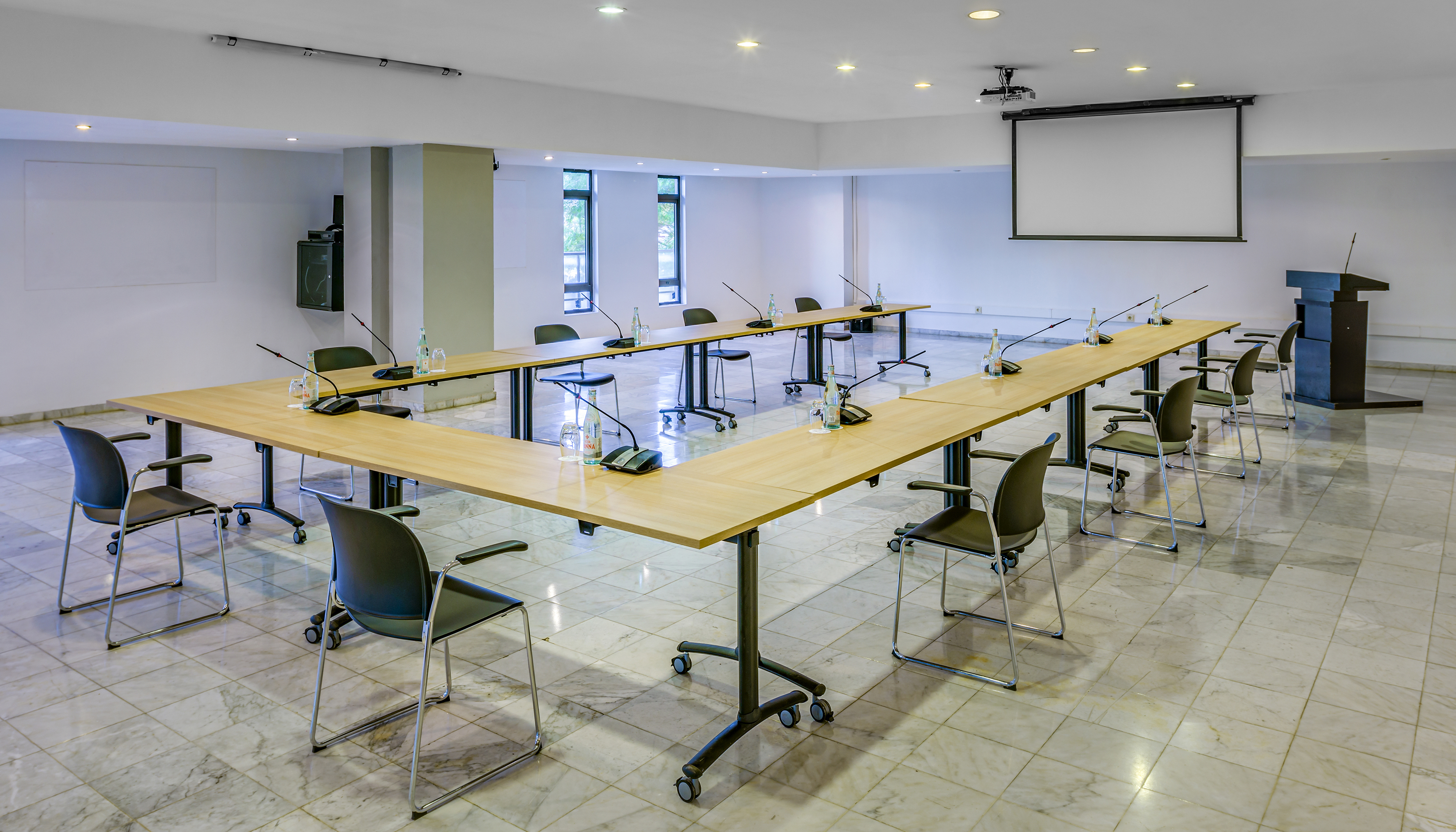 a room with a large table and chairs