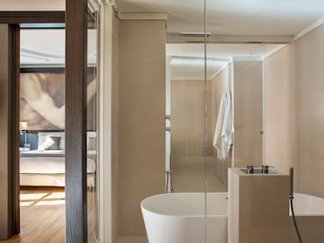 a bathroom with a glass shower door