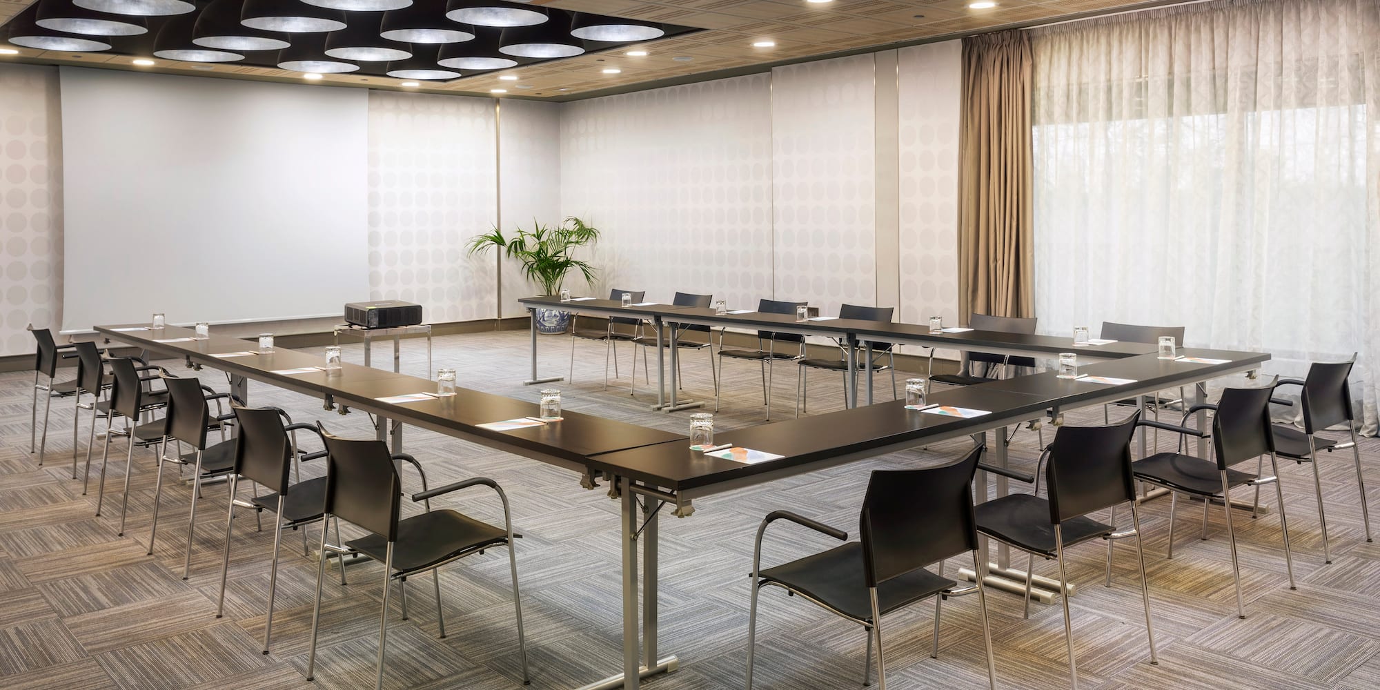 a room with a large table and chairs