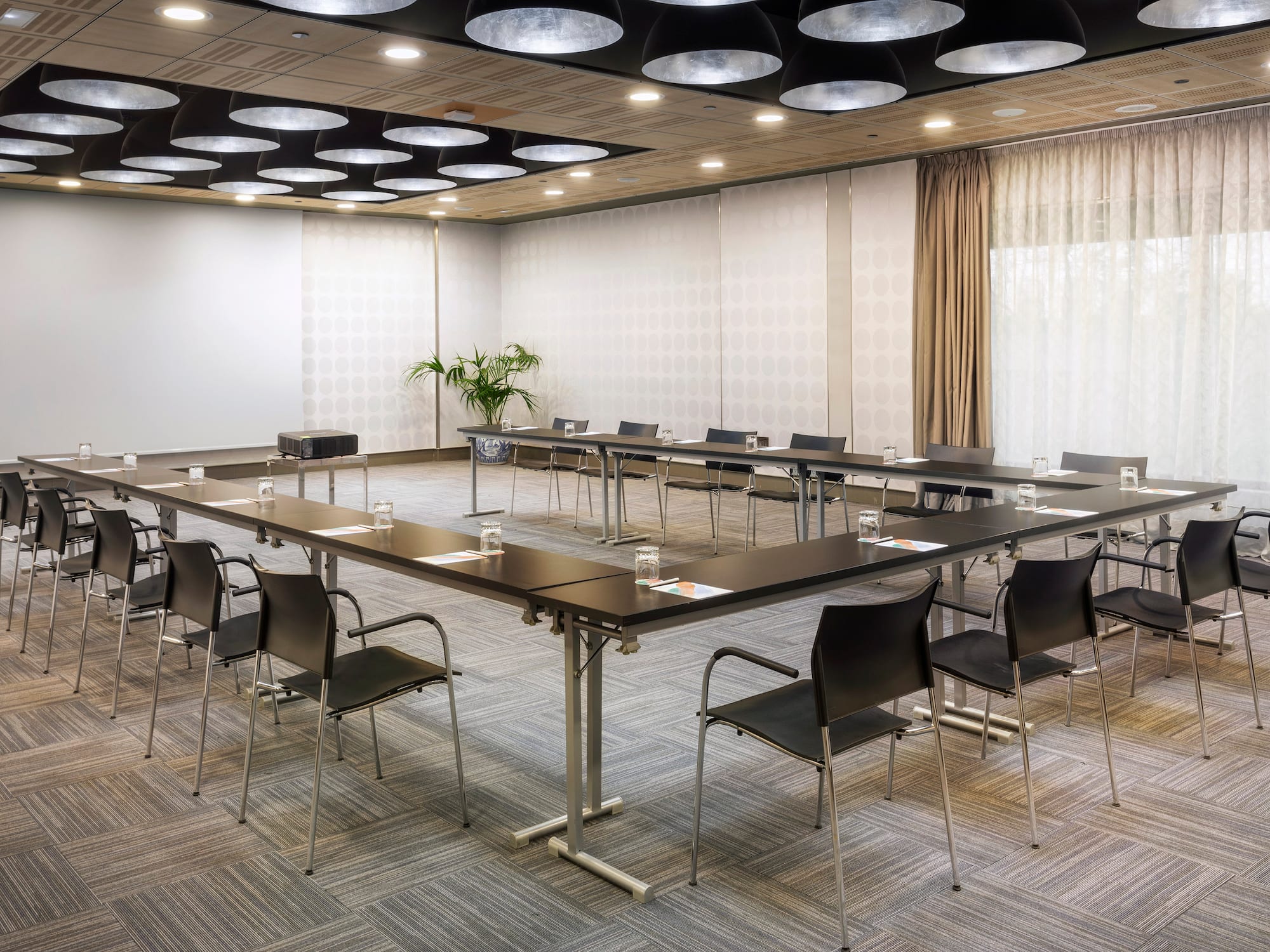 a room with a large table and chairs