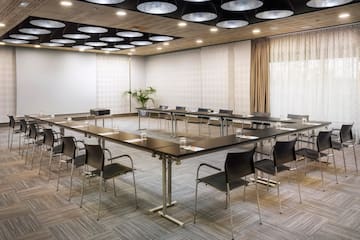 a room with a large table and chairs