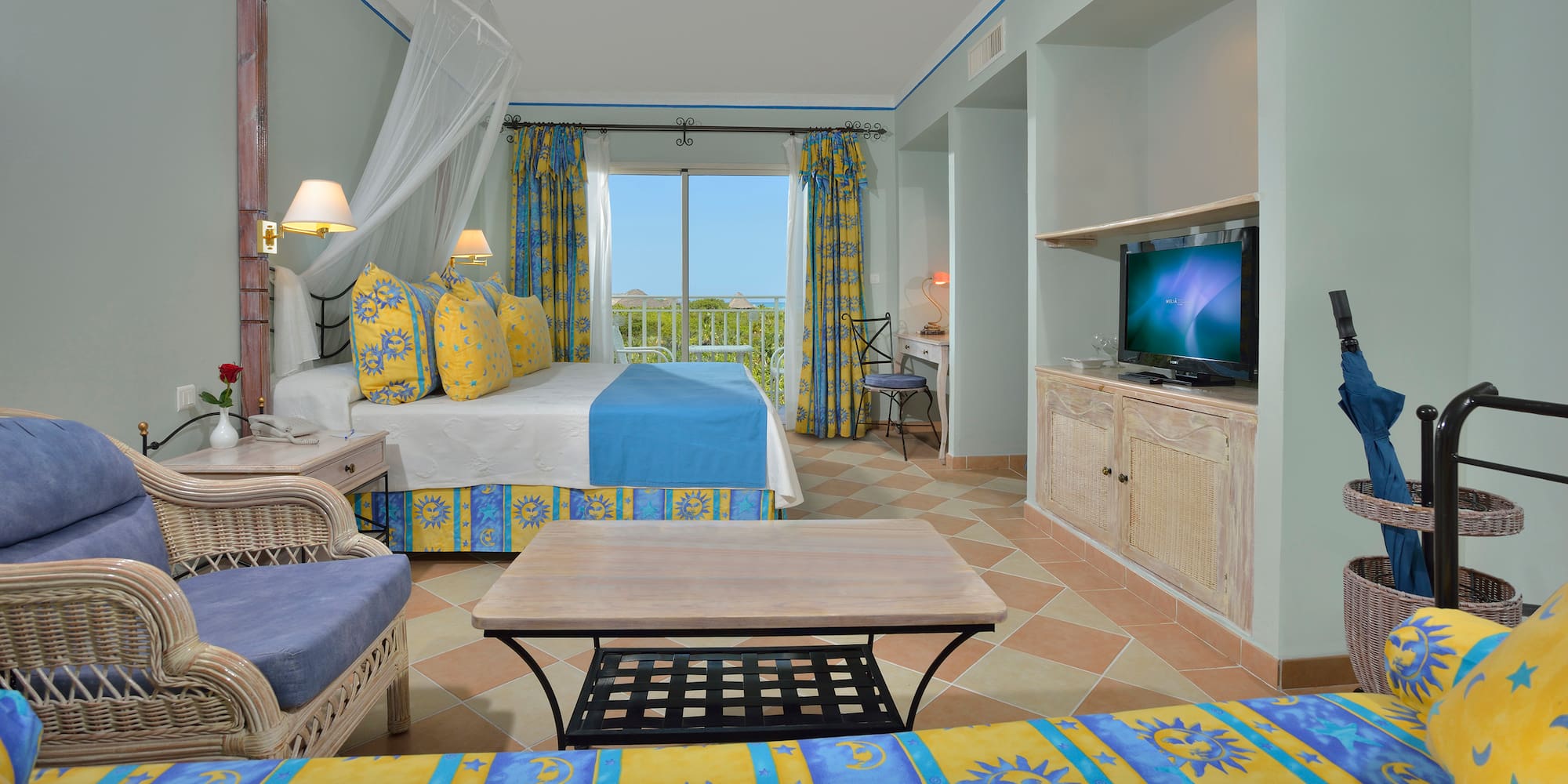 a room with a bed and a television