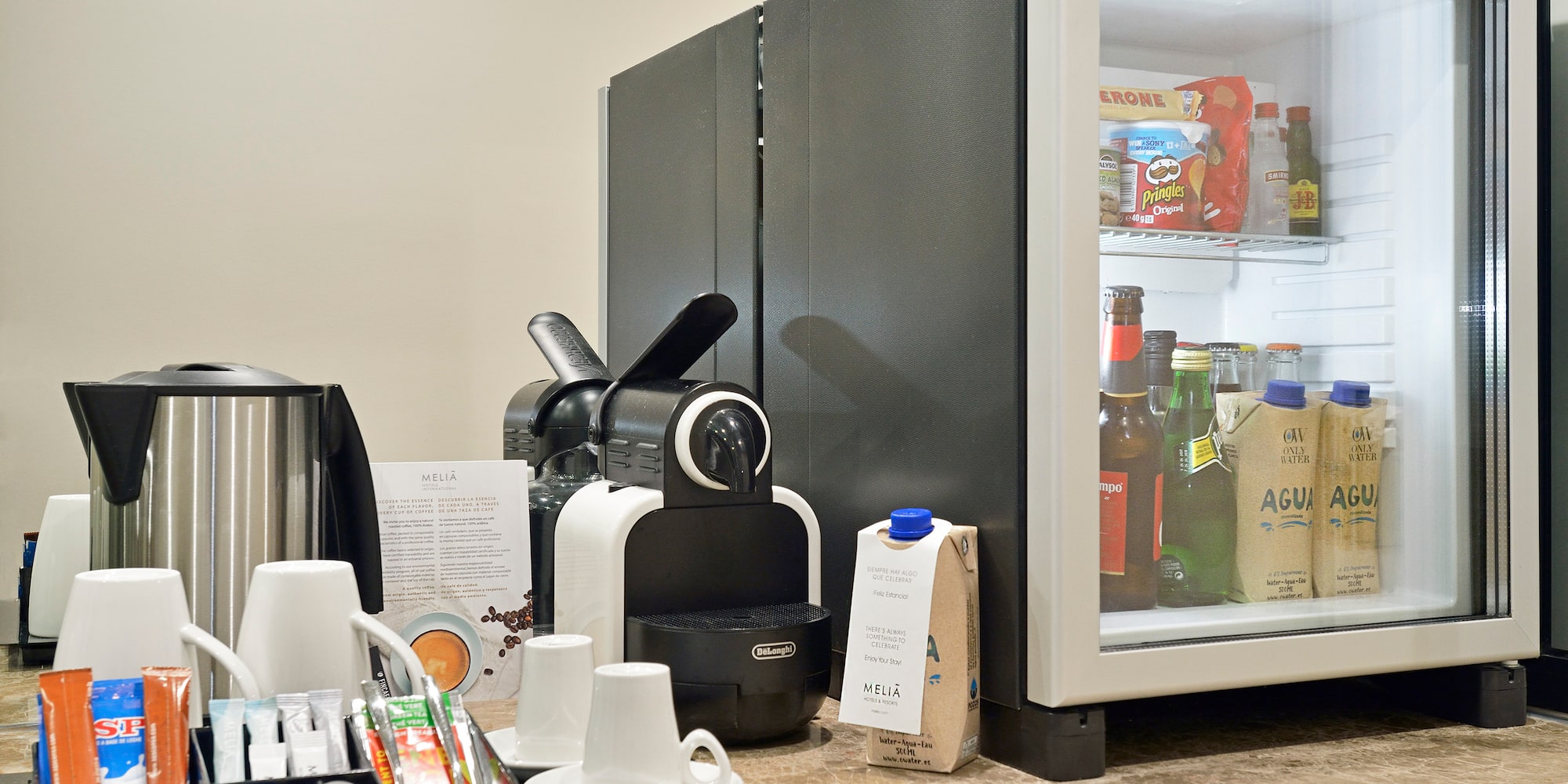 a coffee machine and coffee cups on a counter