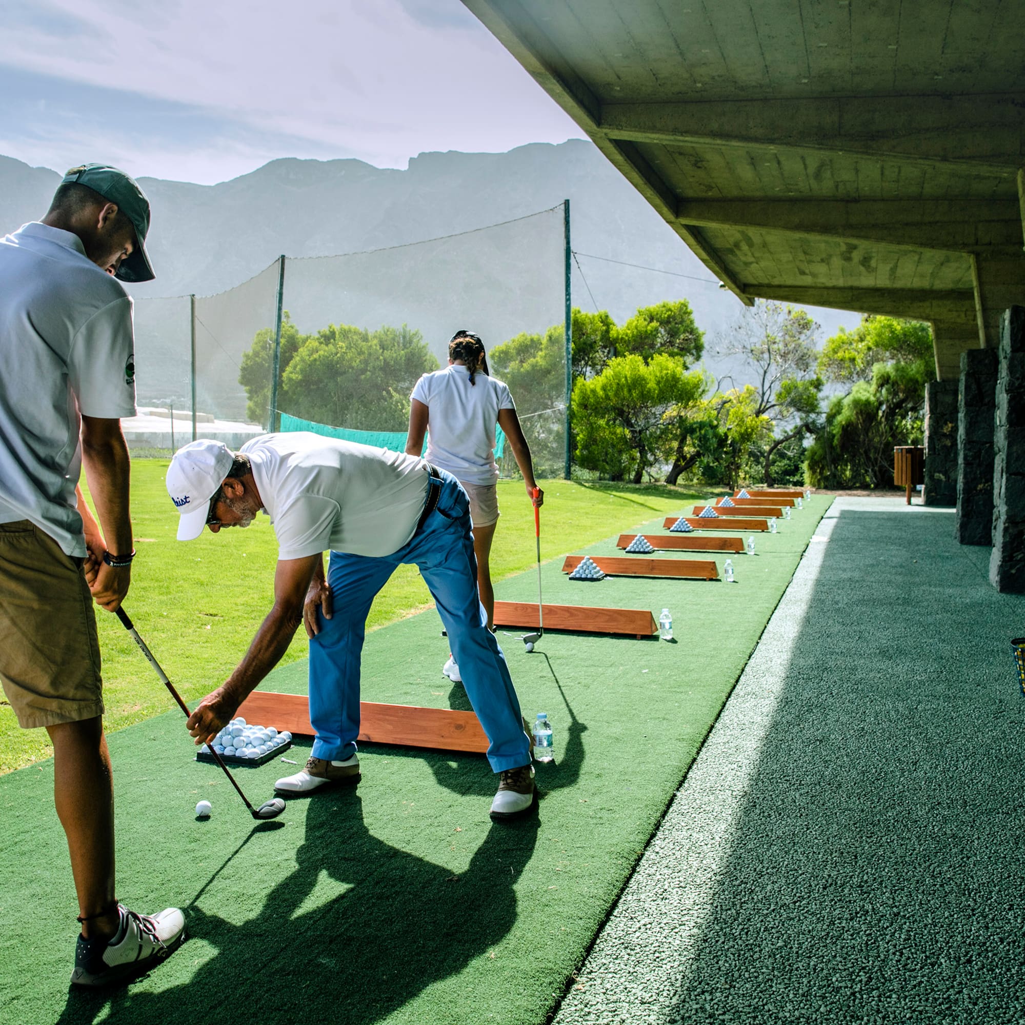 a group of people playing golf