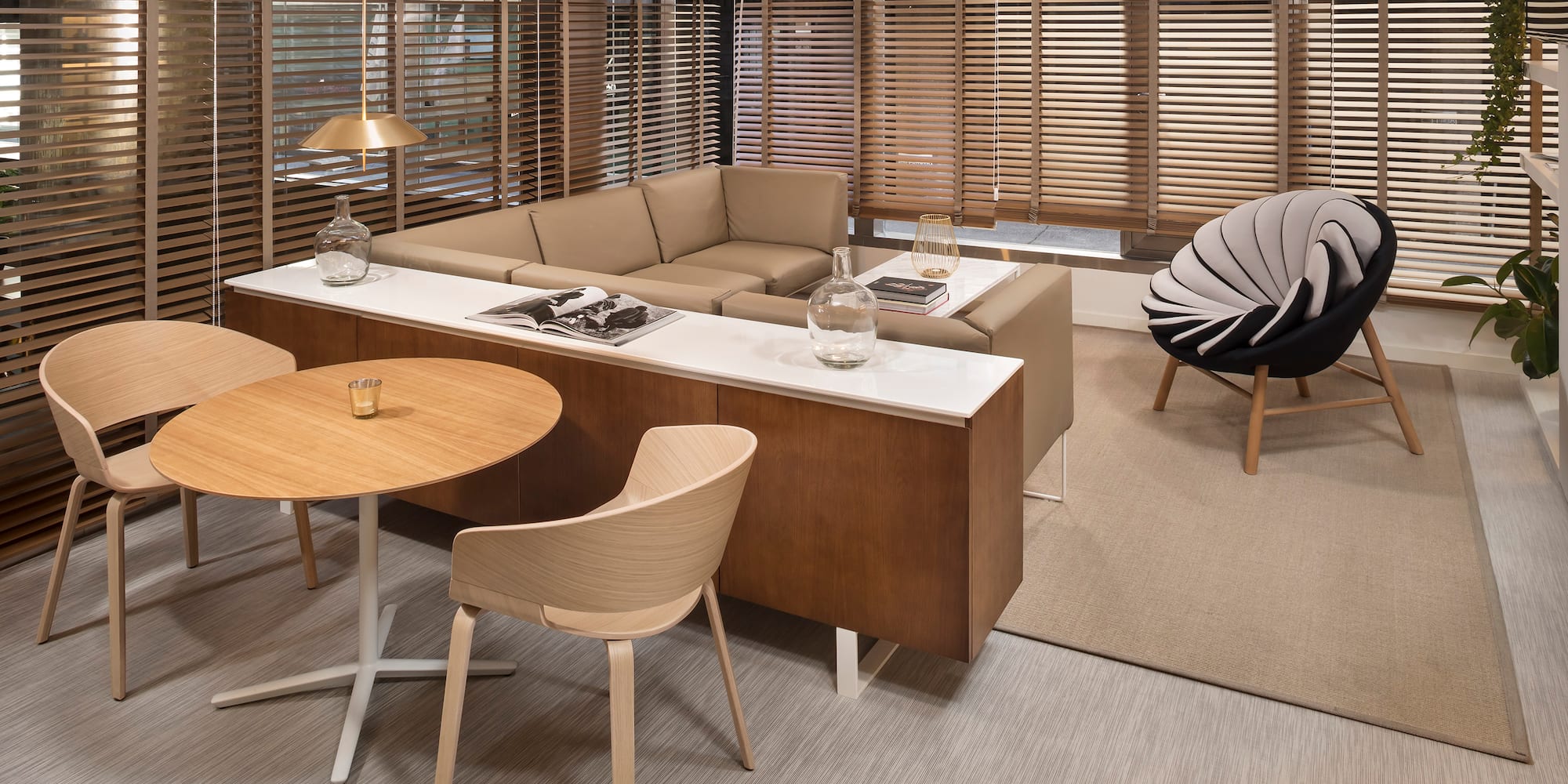 a room with a couch and chairs