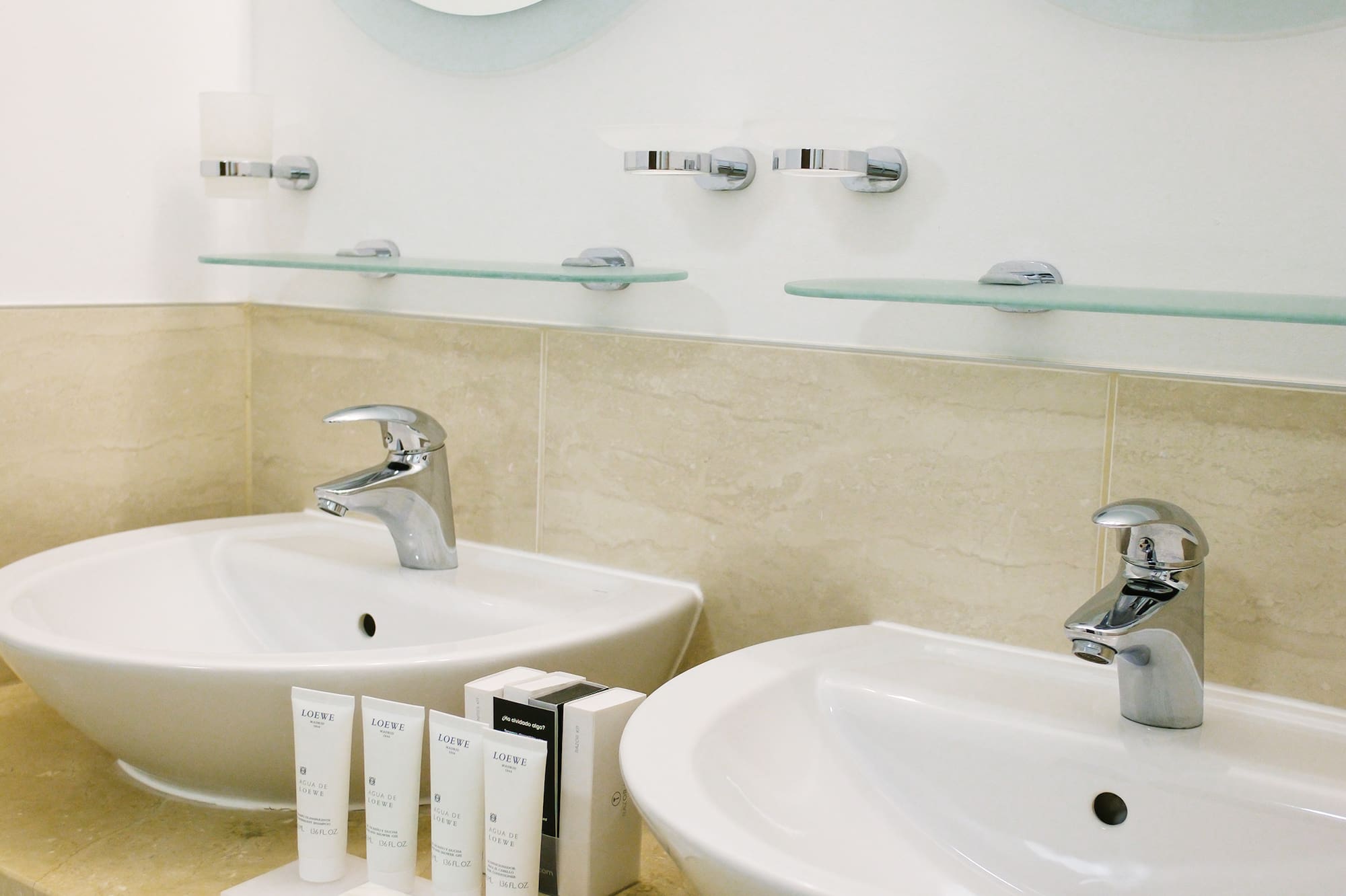 a bathroom with two sinks and mirrors