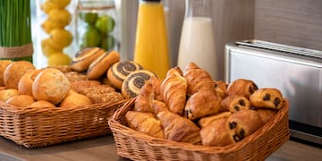 a basket of pastries and croissants