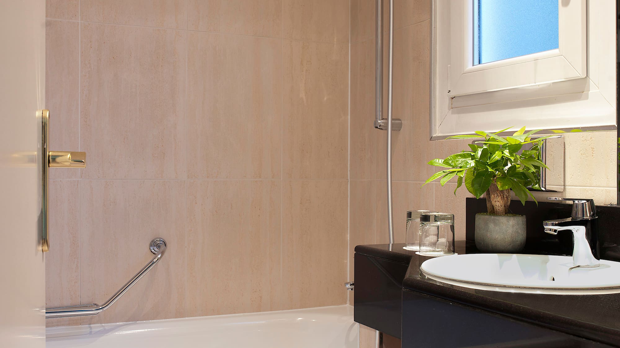 a bathroom with a sink and bathtub