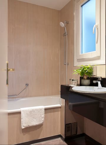 a bathroom with a sink and bathtub