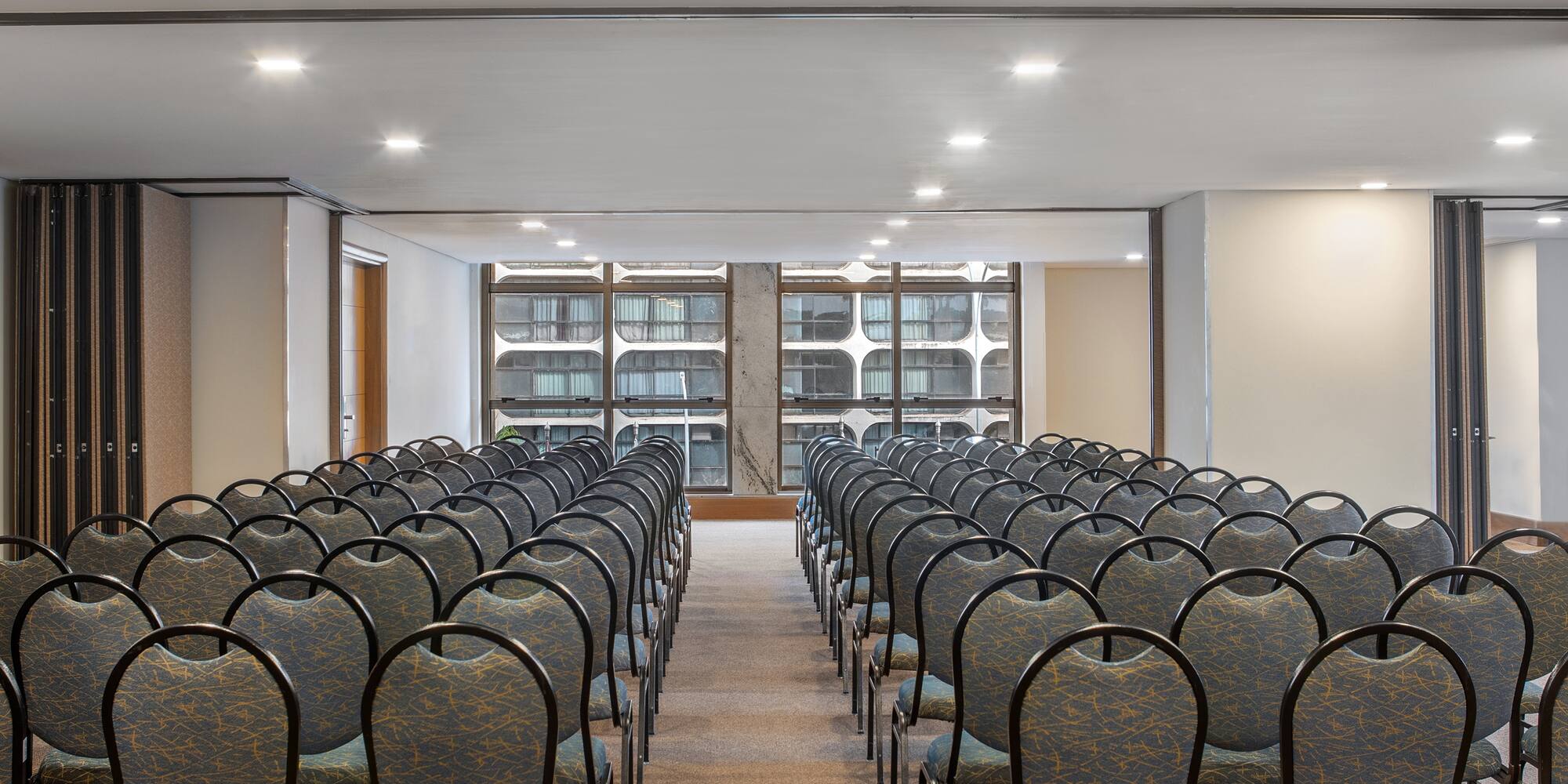 a room with rows of chairs