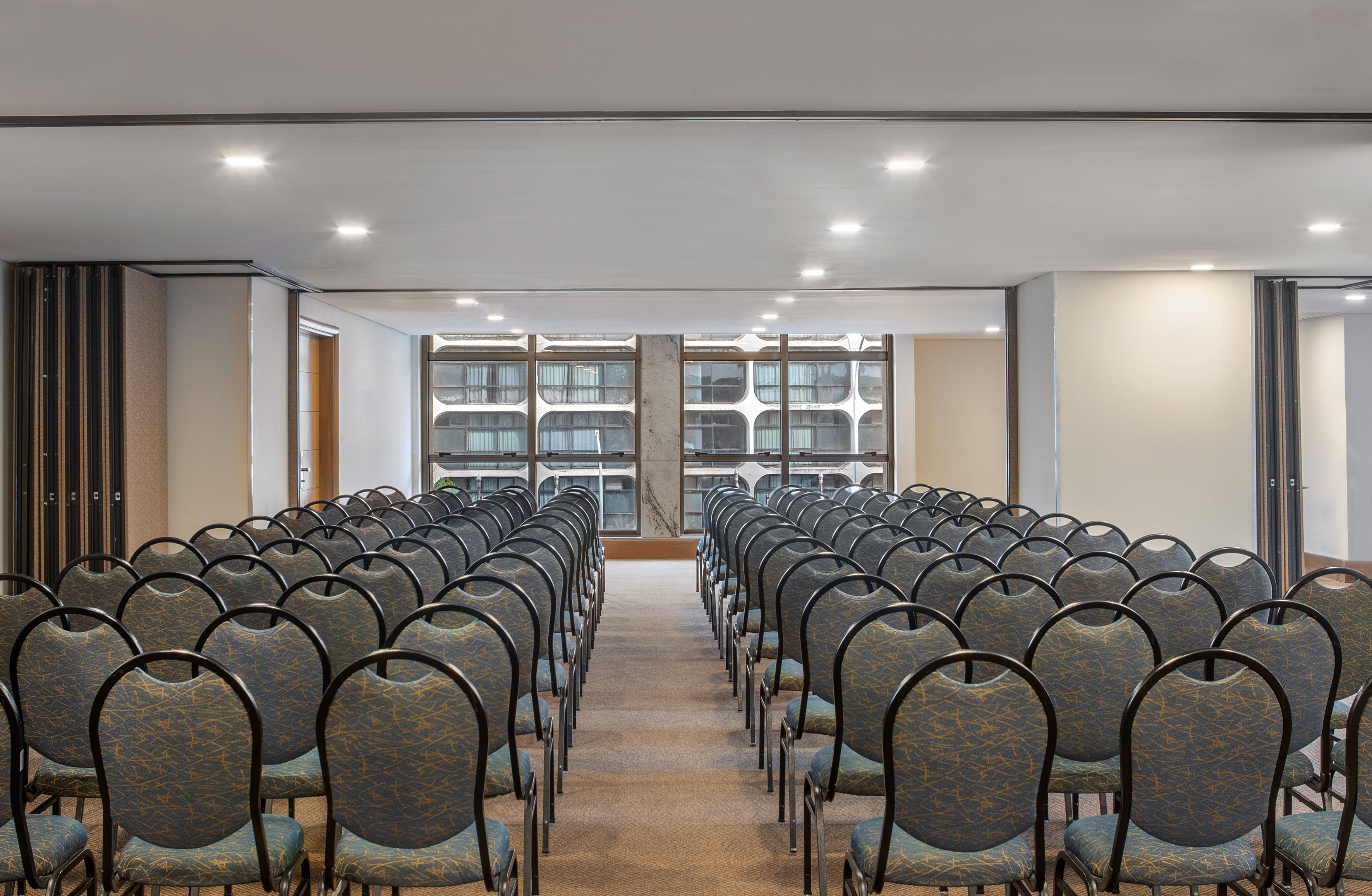 a room with rows of chairs