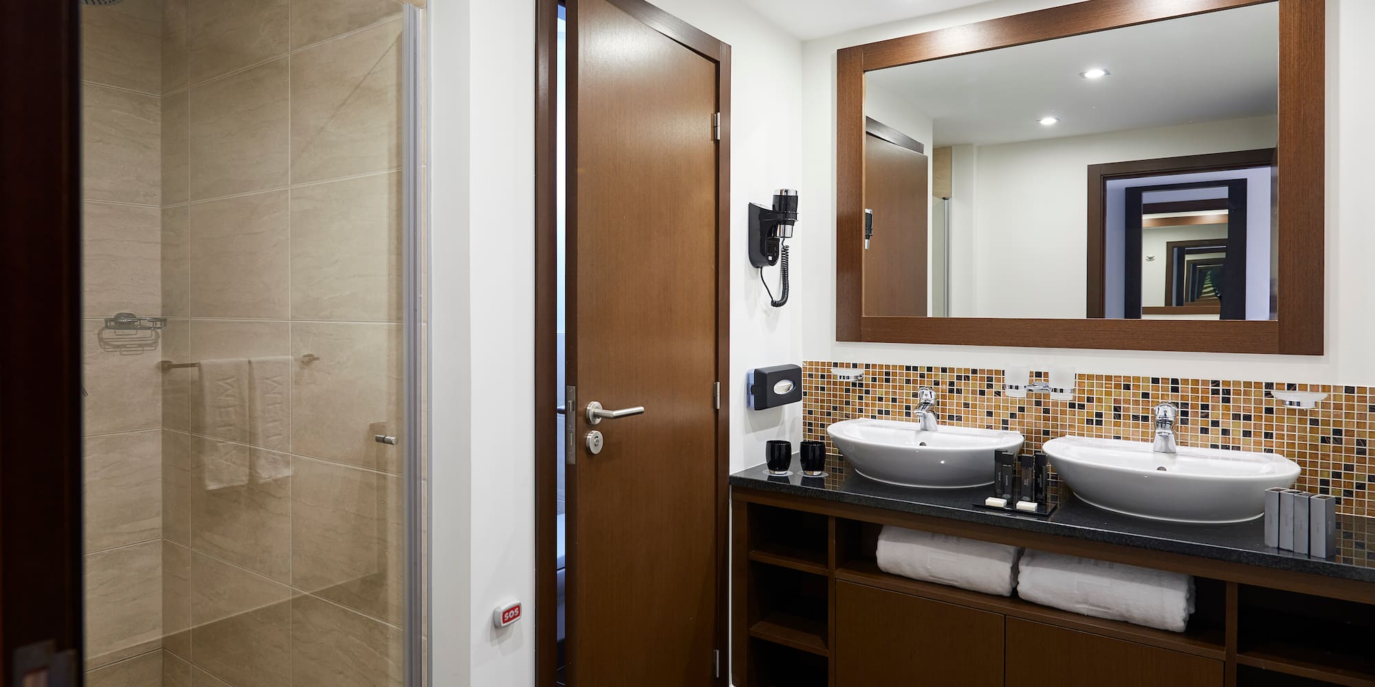 a bathroom with a mirror and sink