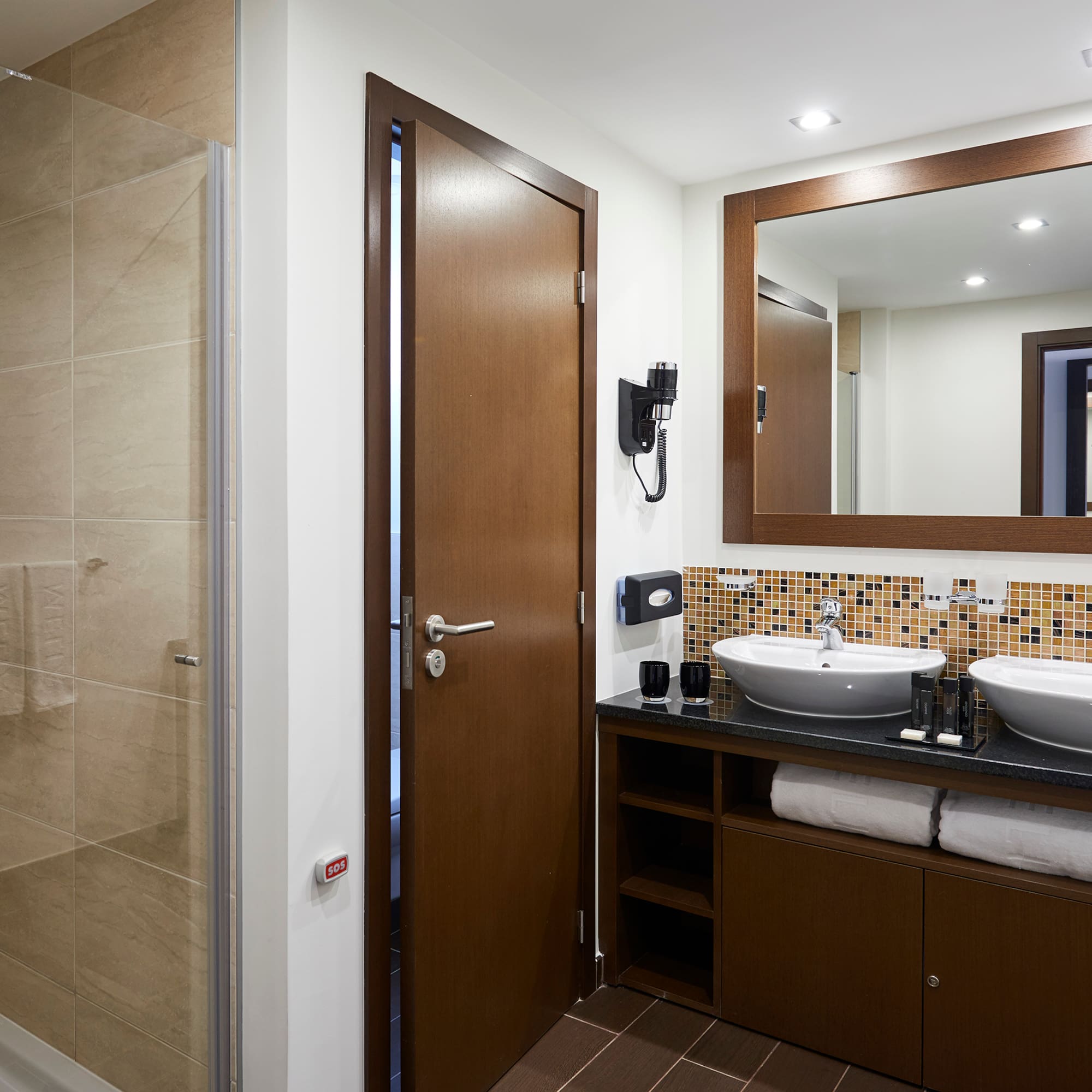 a bathroom with a mirror and sink